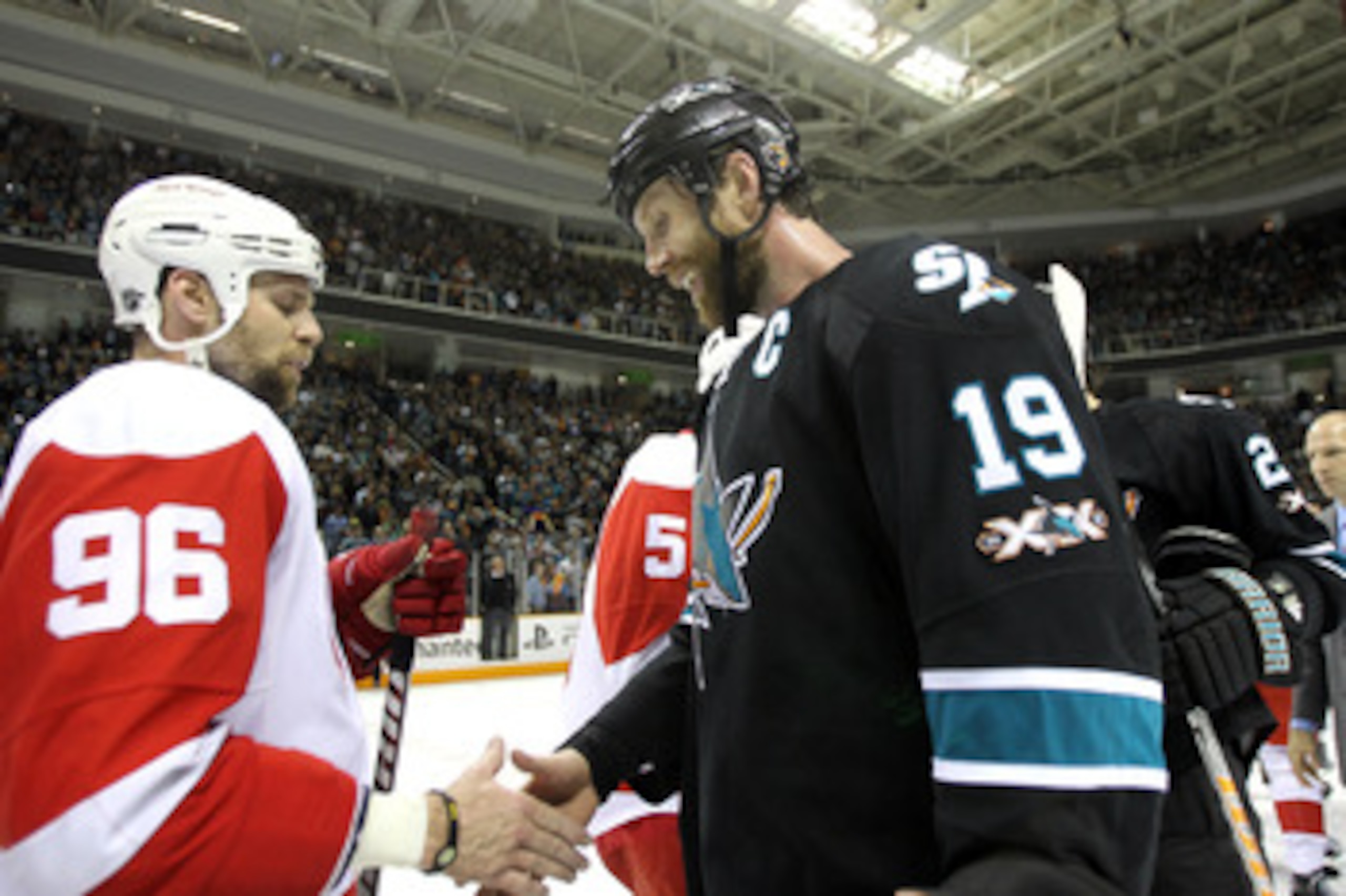SAN JOSE, CA - MAY 12:  Joe Thornton #19 of the San Jose Sharks shakes hands with Tomas Holmstrom #96 of the Detroit Red Wings after the Sharks won Game Seven of the Western Conference Semifinals during the 2011 NHL Stanley Cup Playoffs at HP Pavilion on