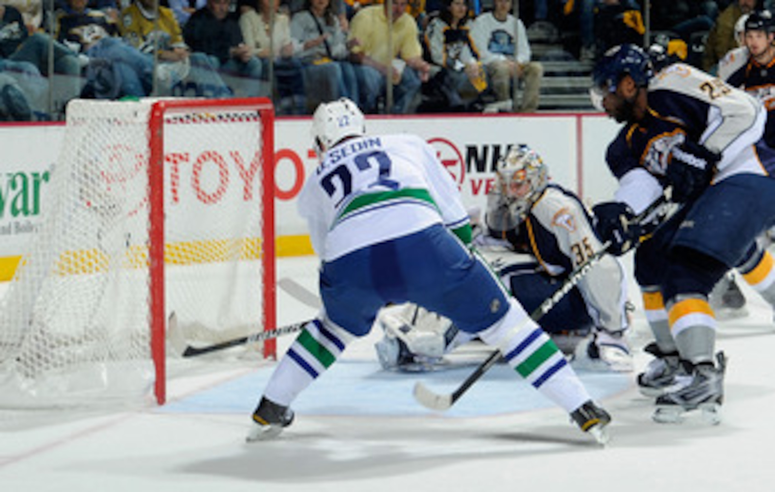NASHVILLE, TN - MAY 09: Daniel Sedin #22 of the Vancouver Canucks scores a goal against Pekka Rinne #35 of the Nashville Predators in Game Six of the Western Conference Semifinals at the Bridgestone Arena on May 9, 2011 in Nashville, Tennessee. (Photo b NASHVILLE, TN - MAY 09: Daniel Sedin #22 of the Vancouver Canucks scores a goal against Pekka Rinne #35 of the Nashville Predators in Game Six of the Western Conference Semifinals at the Bridgestone Arena on May 9, 2011 in Nashville, Tennessee. (Photo b