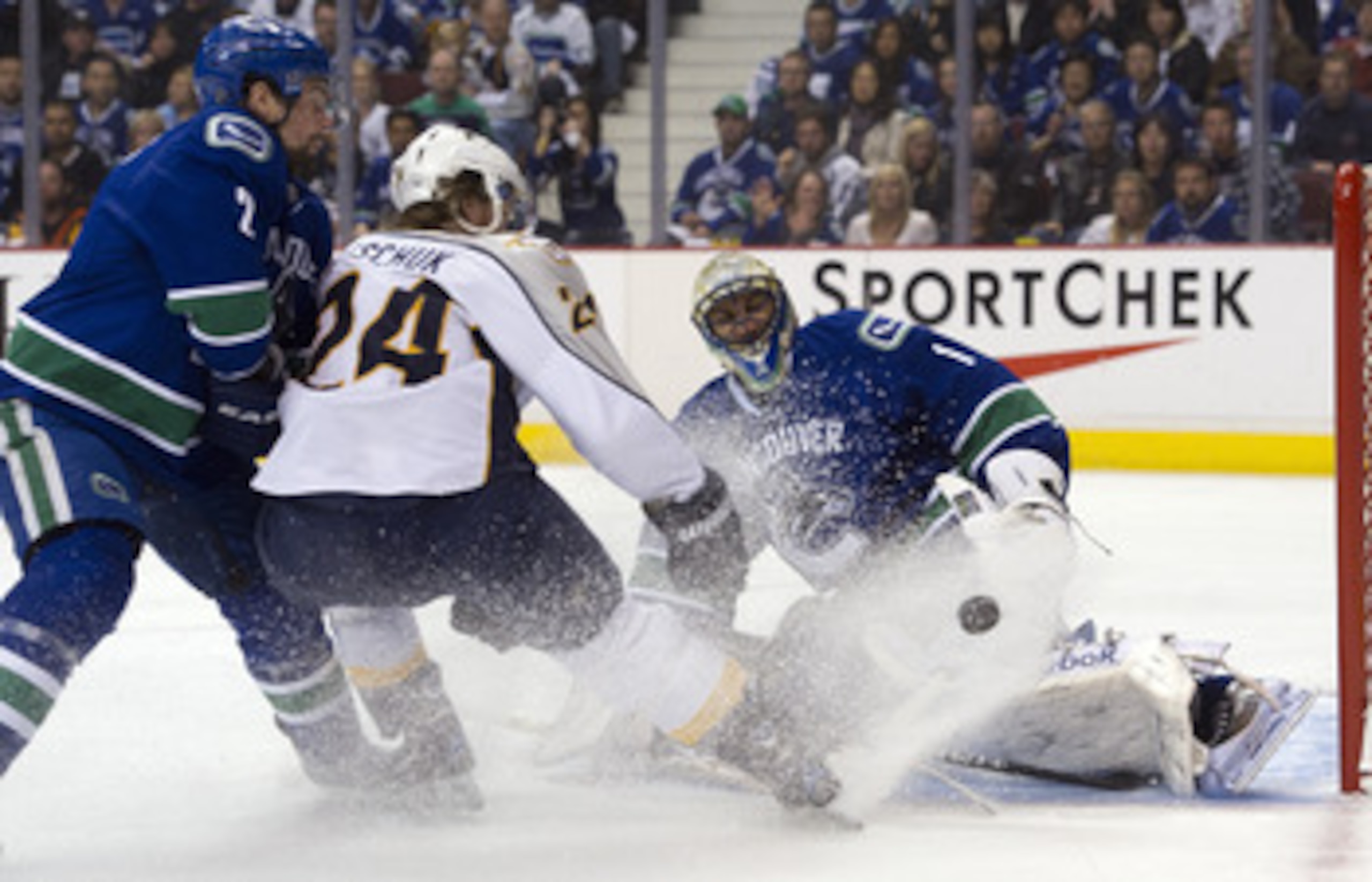 VANCOUVER, CANADA - APRIL 30: Goalie Roberto Luongo #1 of the Vancouver Canucks stops Matt Halischuck #24 of the Nashville Predators in close during the first period in Game Two of the Western Conference Semifinals during the 2011 NHL Stanley Cup Playoffs VANCOUVER, CANADA - APRIL 30: Goalie Roberto Luongo #1 of the Vancouver Canucks stops Matt Halischuck #24 of the Nashville Predators in close during the first period in Game Two of the Western Conference Semifinals during the 2011 NHL Stanley Cup Playoffs