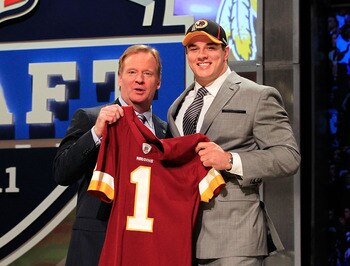 NEW YORK, NY - APRIL 28:  NFL Commissioner Roger Goodell (L) poses for a photo with Ryan Kerrigan, #16 overall pick by the Washington Redskins, on stage during the 2011 NFL Draft at Radio City Music Hall on April 28, 2011 in New York City.  (Photo by Chri