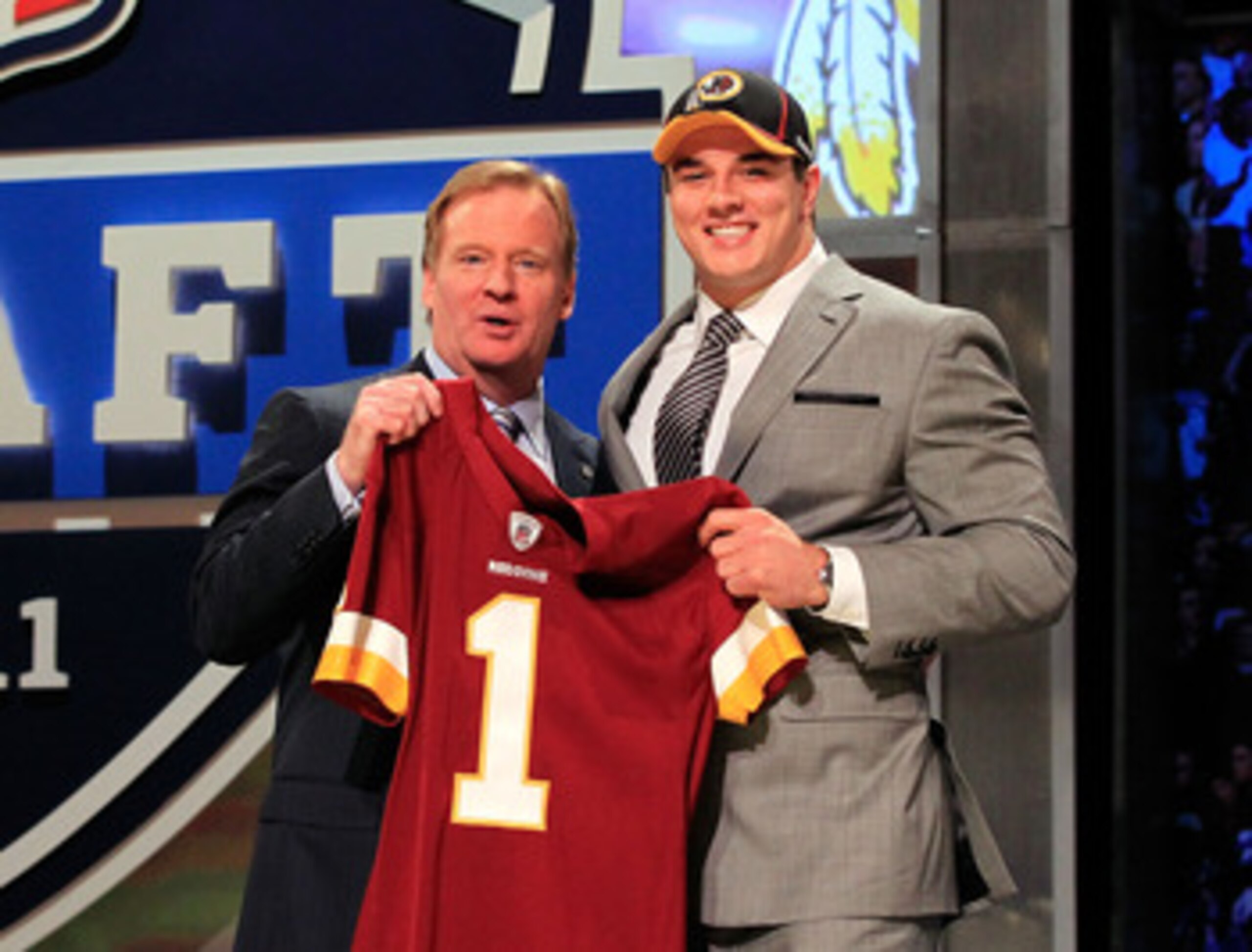 NEW YORK, NY - APRIL 28:  NFL Commissioner Roger Goodell (L) poses for a photo with Ryan Kerrigan, #16 overall pick by the Washington Redskins, on stage during the 2011 NFL Draft at Radio City Music Hall on April 28, 2011 in New York City.  (Photo by Chri