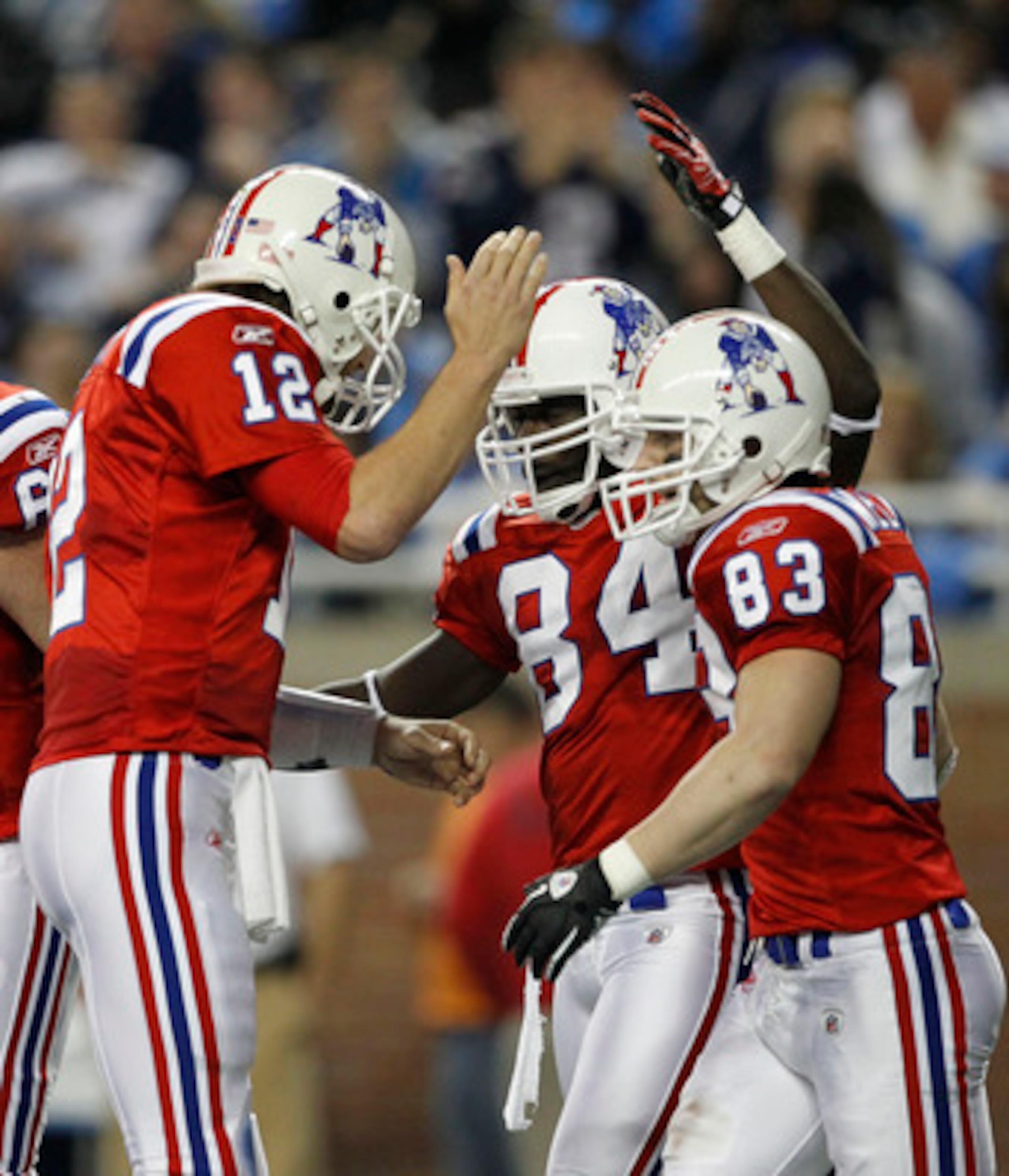 DETROIT - NOVEMBER 25: Deion Branch #84 of the New England Patriots celebrates with teammates Tom Brady #12 and Wes Welker #83 after a fourth quarter touchdown during the game against the Detroit Lions at Ford Field on November 25, 2010 in Detroit, Michig