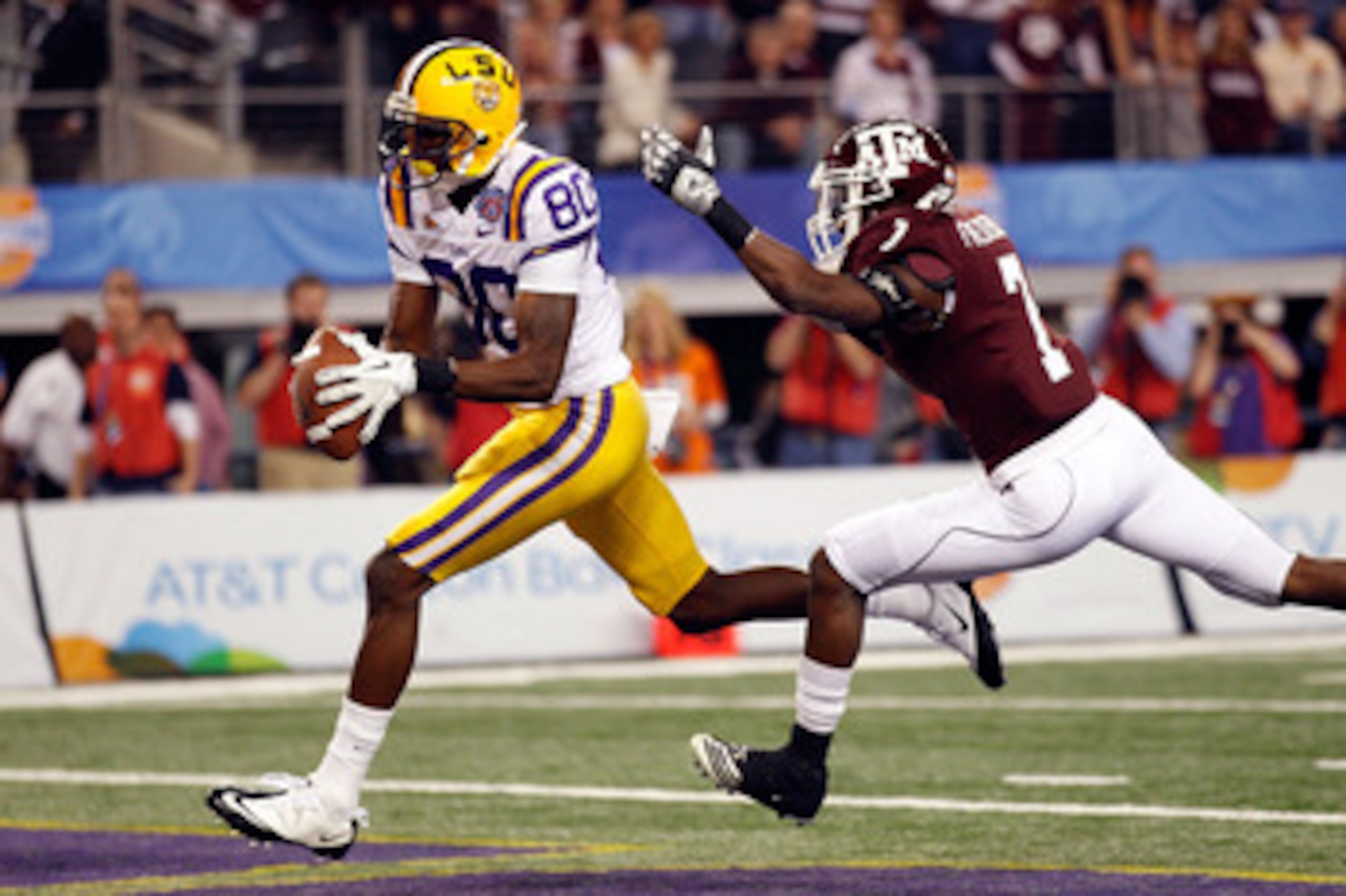 ARLINGTON, TX - JANUARY 07:  Terrence Toliver #80 of the Louisiana State University Tigers catches a touchdown pass over Terrence McCoy #7 of the Texas A&M Aggies during the AT&T Cotton Bowl at Cowboys Stadium on January 7, 2011 in Arlington, Texas.  (Pho