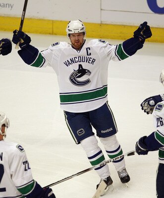 CHICAGO, IL - APRIL 17: Henrik Sedin #33 of the Vancouver Canucks celebrates a teammates' goal against the Chicago Blackhawks in Game Three of the Western Conference Quarterfinals during the 2011 NHL Stanley Cup Playoffs at the United Center on April 17, CHICAGO, IL - APRIL 17: Henrik Sedin #33 of the Vancouver Canucks celebrates a teammates' goal against the Chicago Blackhawks in Game Three of the Western Conference Quarterfinals during the 2011 NHL Stanley Cup Playoffs at the United Center on April 17,