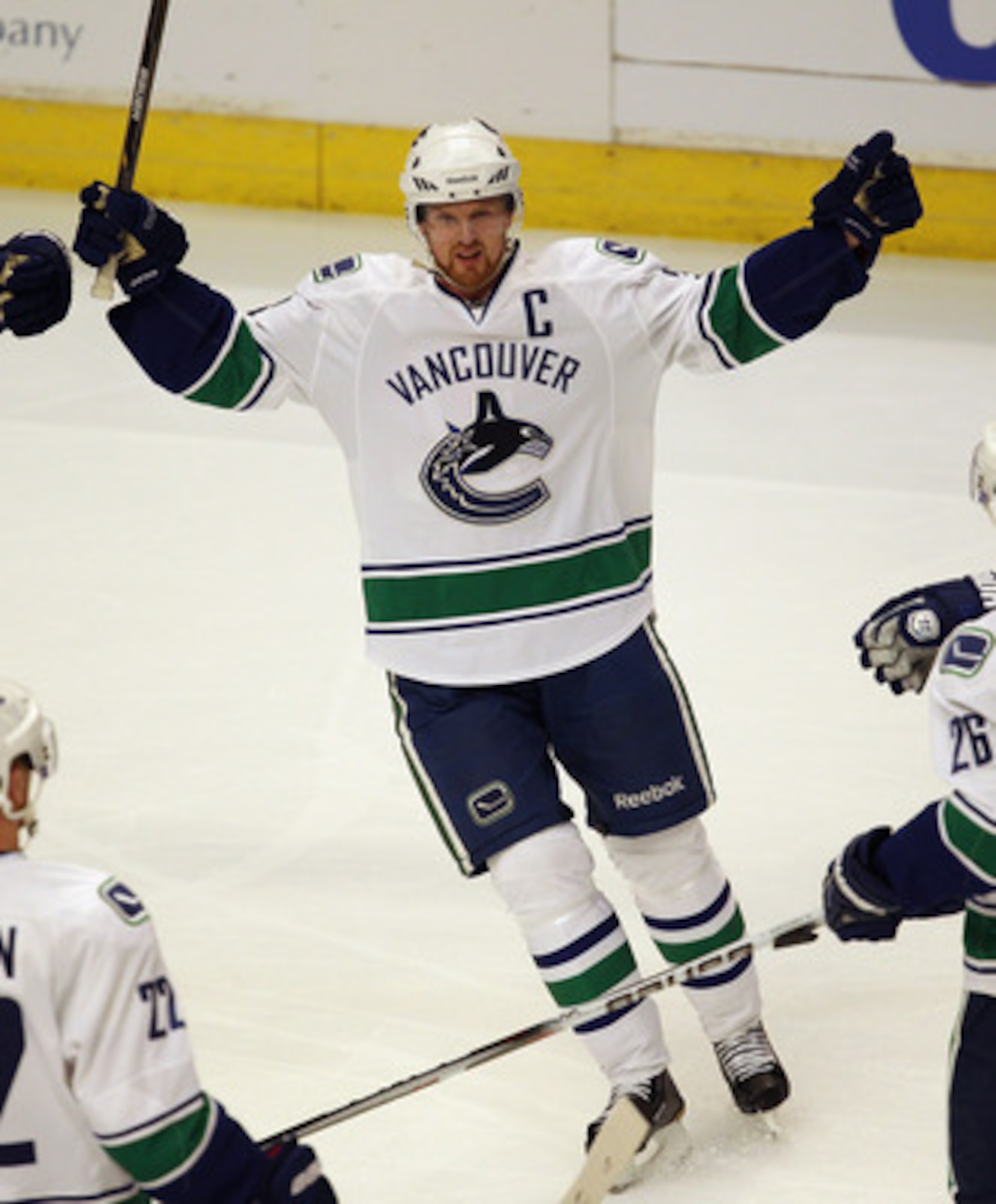 CHICAGO, IL - APRIL 17: Henrik Sedin #33 of the Vancouver Canucks celebrates a teammates' goal against the Chicago Blackhawks in Game Three of the Western Conference Quarterfinals during the 2011 NHL Stanley Cup Playoffs at the United Center on April 17, 