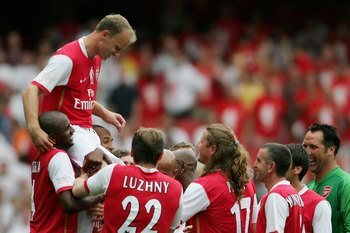 LONDON - JULY 22:  Dennis Bergkamp of Arsenal is carried aloft by teammates, following his final game during the Dennis Bergkamp testimonial match between Arsenal and Ajax at the Emirates Stadium on July 22, 2006 in London, England.  (Photo by Jamie McDon