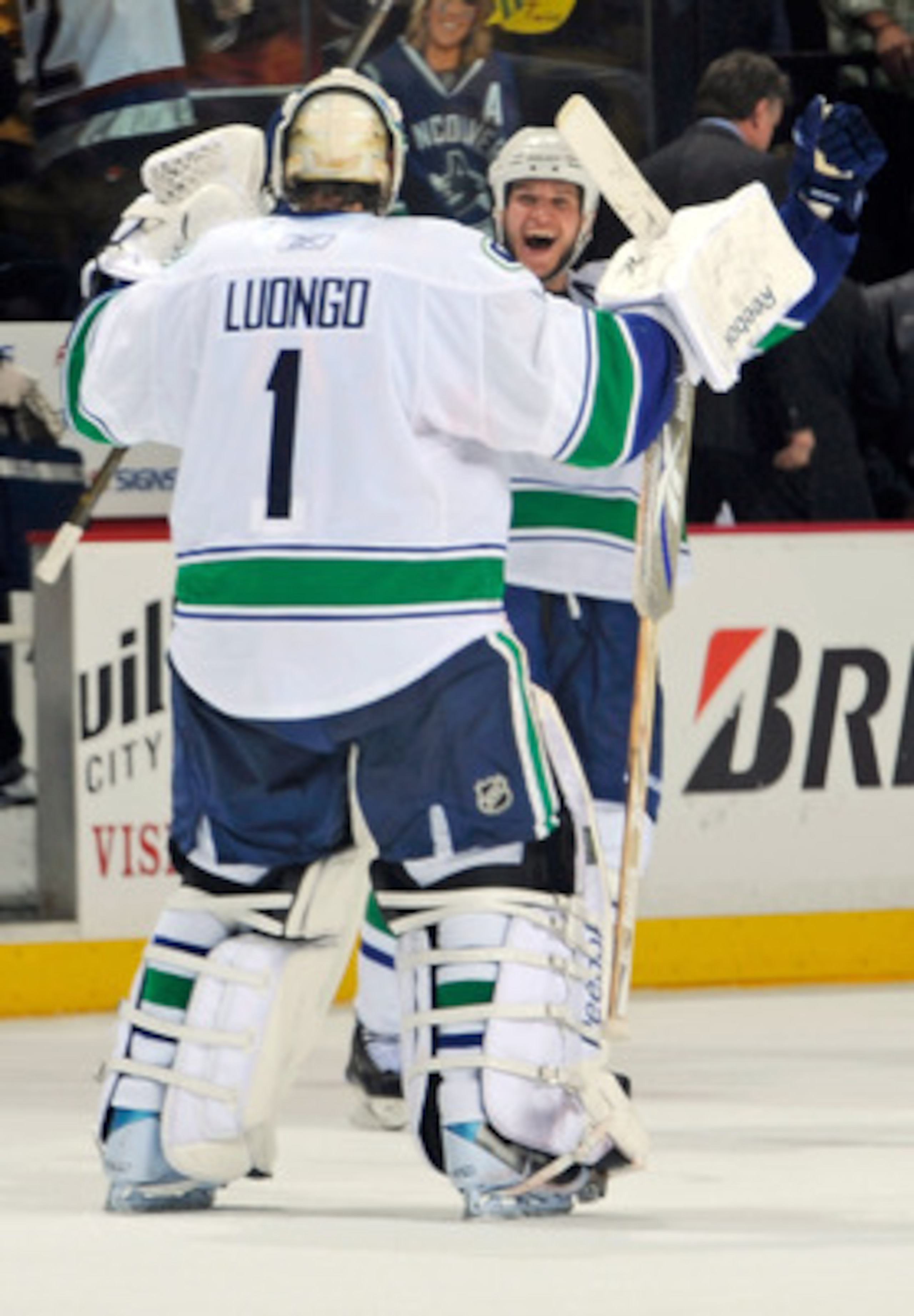 NASHVILLE, TN - MAY 03:  Kevin Bieksa #3 of the Vancouver Canucks congratulates teammate Roberto Luongo on defeating the Nashville Predators in Game Three of the Western Conference Semifinals during the 2011 NHL Stanley Cup Playoffs at Bridgestone Arena o