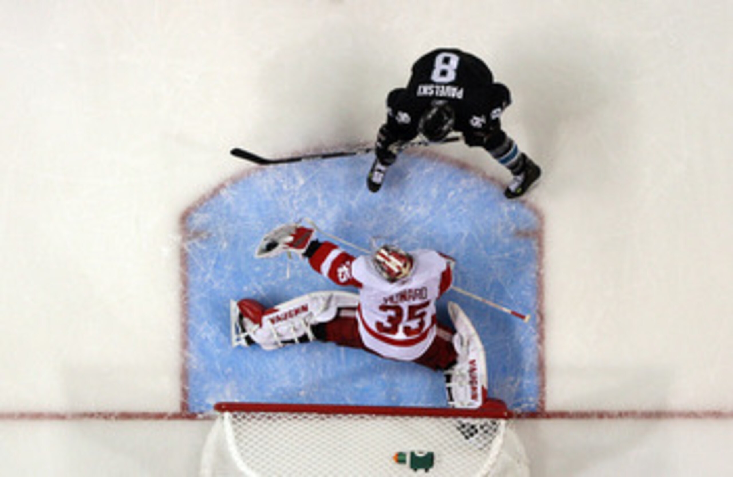 SAN JOSE, CA - APRIL 29:  Jimmy Howard #35 of the Detroit Red Wings makes a save on a shot taken by Joe Pavelski #8 of the San Jose Sharks in Game One of the Western Conference Semifinals during the 2011 NHL Stanley Cup Playoffs at HP Pavilion on April 29
