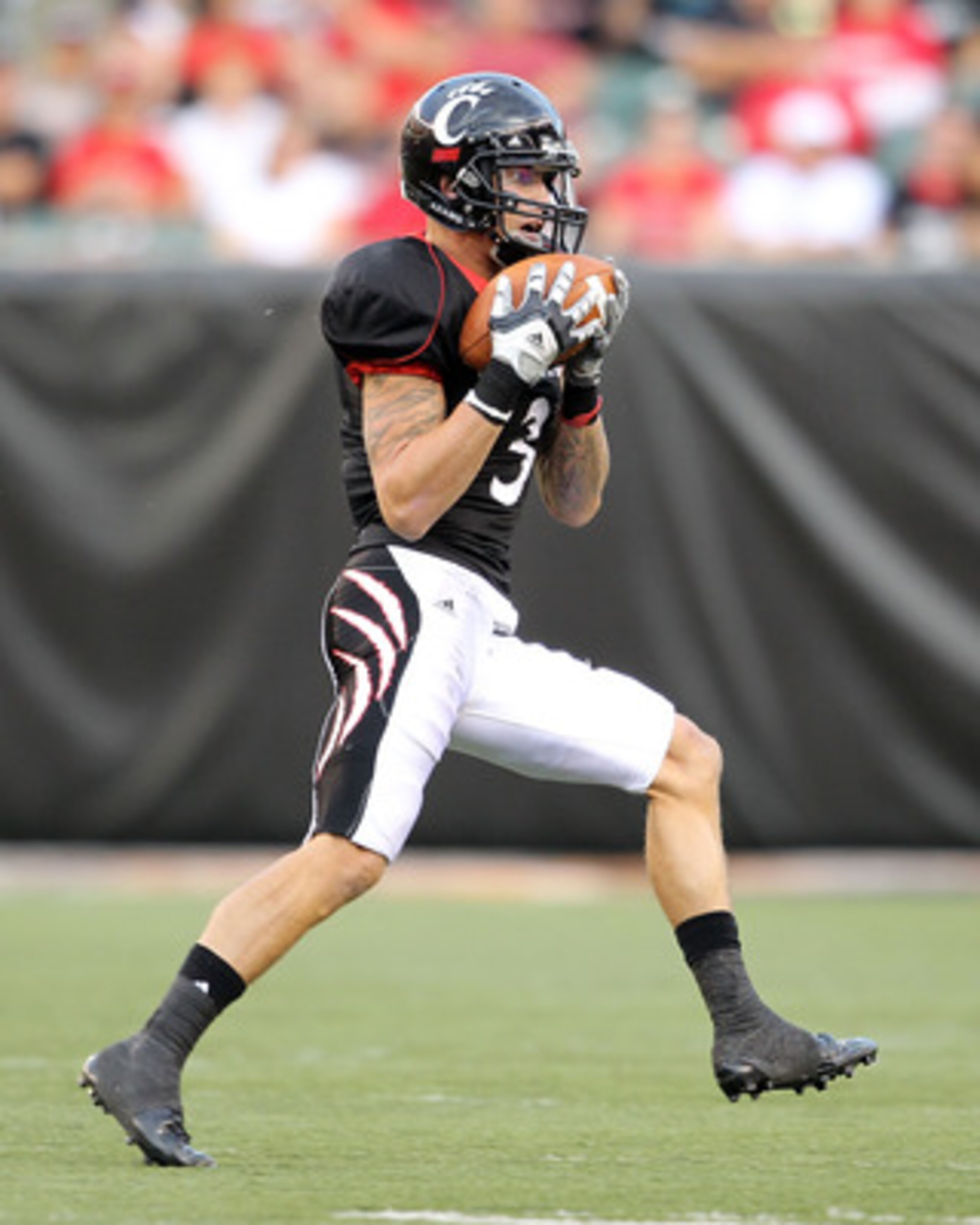 CINCINNATI - SEPTEMBER 25:  D J Woods #3 of the Cincinnati Bearcats catches a pass during the game against the Oklahoma Sooners at Paul Brown Stadium on September 25, 2010 in Cincinnati, Ohio.  (Photo by Andy Lyons/Getty Images)