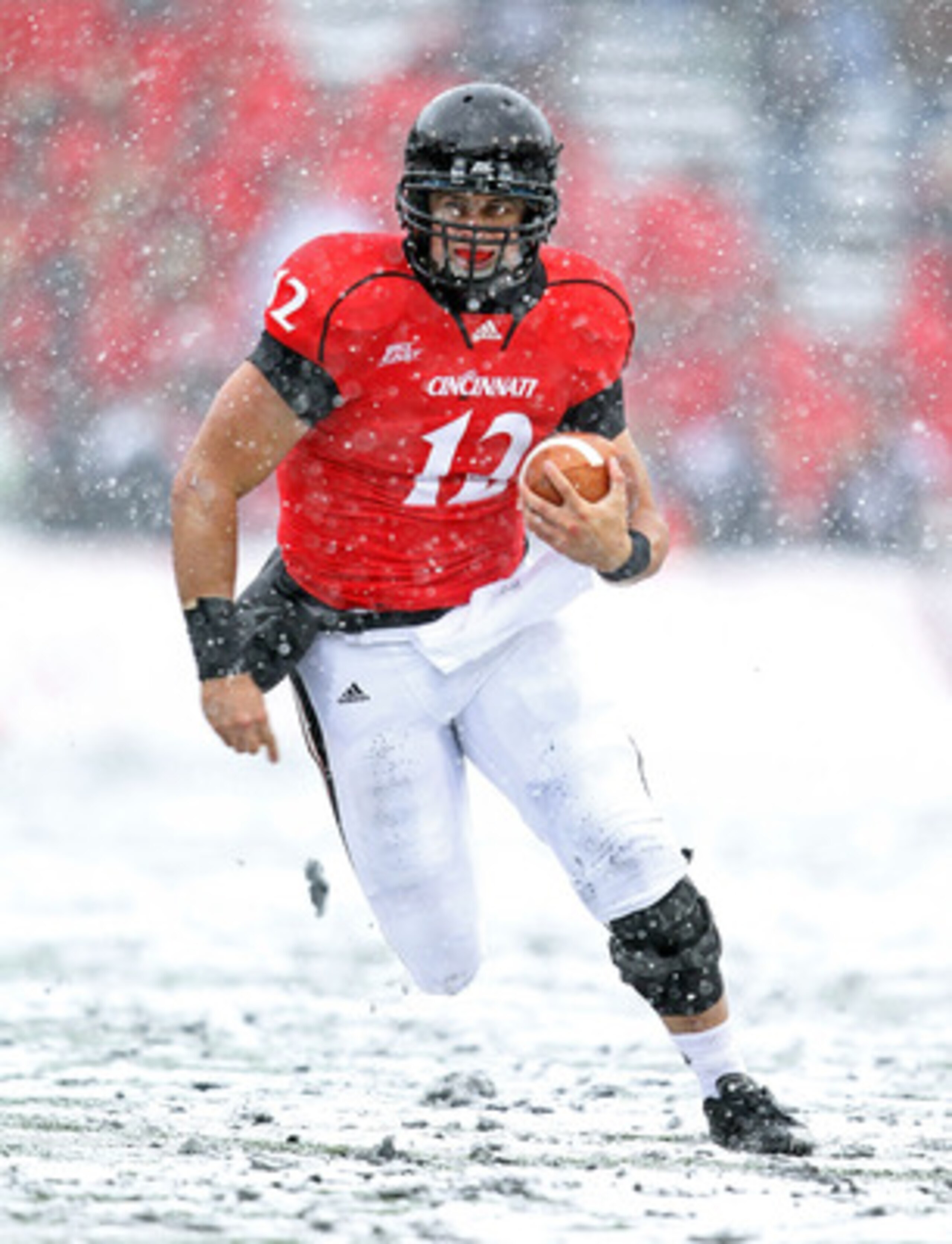 CINCINNATI, OH - DECEMBER 04:  Zach Collaros #12 of the Cincinnati Bearcats runs with the ball  during the Big East Conference game against the Pittsburgh Panthers at Nippert Stadium on December 4, 2010 in Cincinnati, Ohio. Pittsburgh won 28-10.  (Photo b