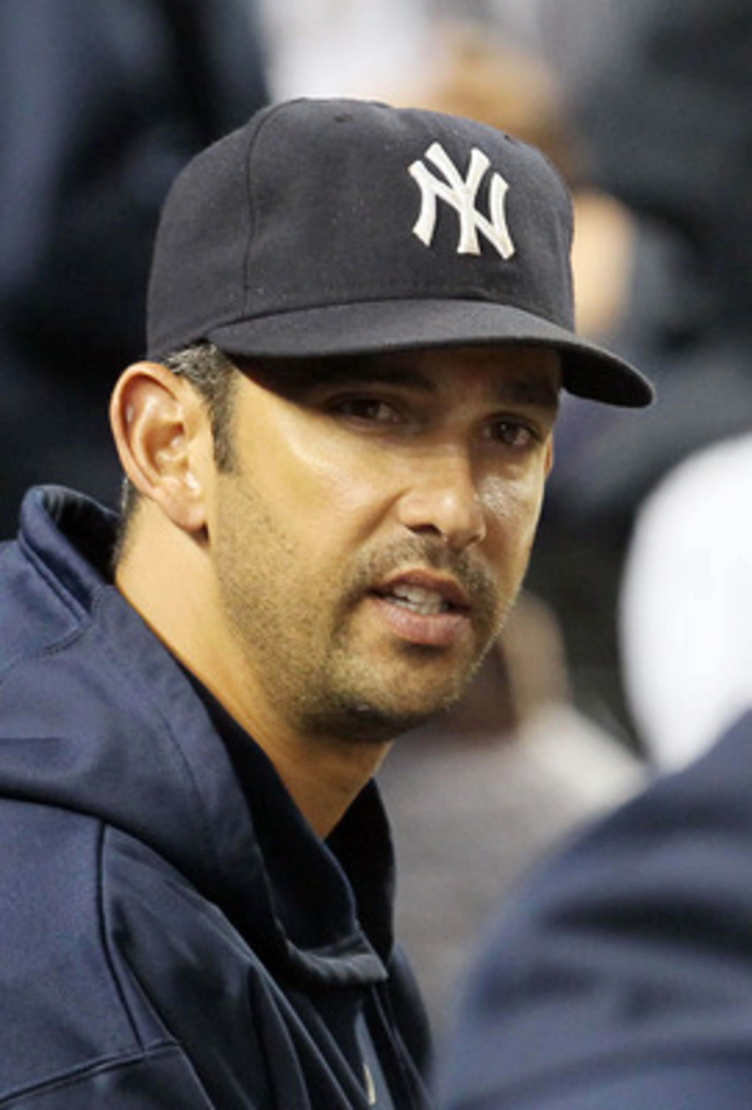 NEW YORK, NY - MAY 14: Jorge Posada #20 of the New York Yankees looks on from the bench during the game against the Boston Red Sox on May 14, 2011 at Yankee Stadium in the Bronx borough of New York City. Posada pulled himself from the starting lineup pri NEW YORK, NY - MAY 14: Jorge Posada #20 of the New York Yankees looks on from the bench during the game against the Boston Red Sox on May 14, 2011 at Yankee Stadium in the Bronx borough of New York City. Posada pulled himself from the starting lineup pri