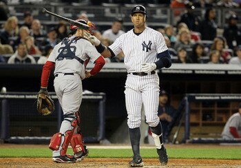 NEW YORK, NY - MAY 14:  Alex Rodriguez #13 of the New York Yankees strikes out to end the third inning as Jason Varitek #33 of the Boston Red Sox heads back to the dugout on May 14, 2011 at Yankee Stadium in the Bronx borough of New York City.  (Photo by