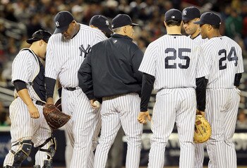 NEW YORK, NY - MAY 14:  CC Sabathia #52 of the New York Yankees leaves the game in the seventh inning against the Boston Red Sox after giving the ball to manager Joe Girardi on May 14, 2011 at Yankee Stadium in the Bronx borough of New York City.  (Photo