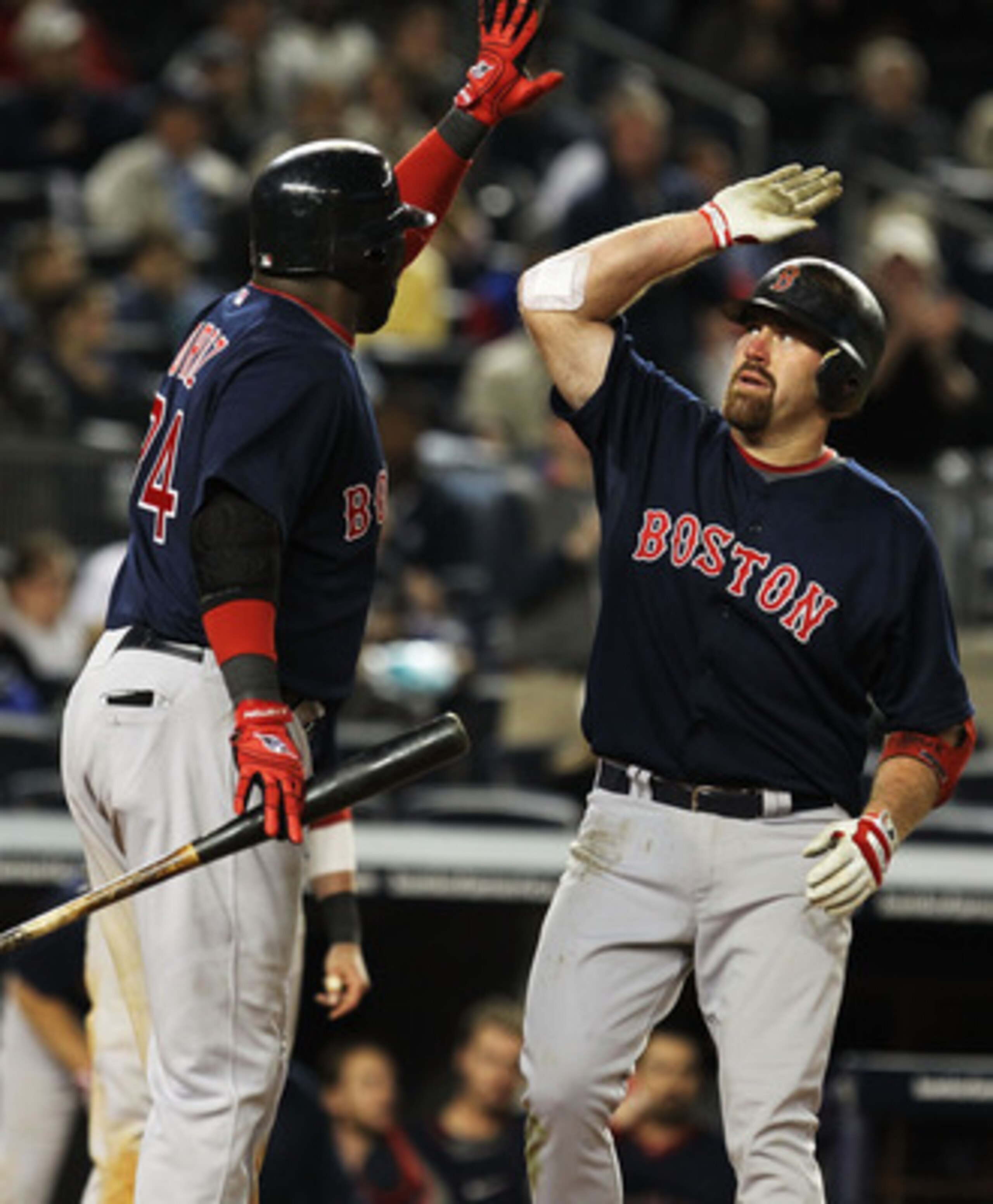 NEW YORK, NY - MAY 13: Kevin Youkilis #20 of the Boston Red Sox is met by David Ortiz #34 after hitting a two run home run against the New York Yankees during their game on May 13, 2011 at Yankee Stadium in the Bronx borough of New York City. (Photo by NEW YORK, NY - MAY 13: Kevin Youkilis #20 of the Boston Red Sox is met by David Ortiz #34 after hitting a two run home run against the New York Yankees during their game on May 13, 2011 at Yankee Stadium in the Bronx borough of New York City. (Photo by