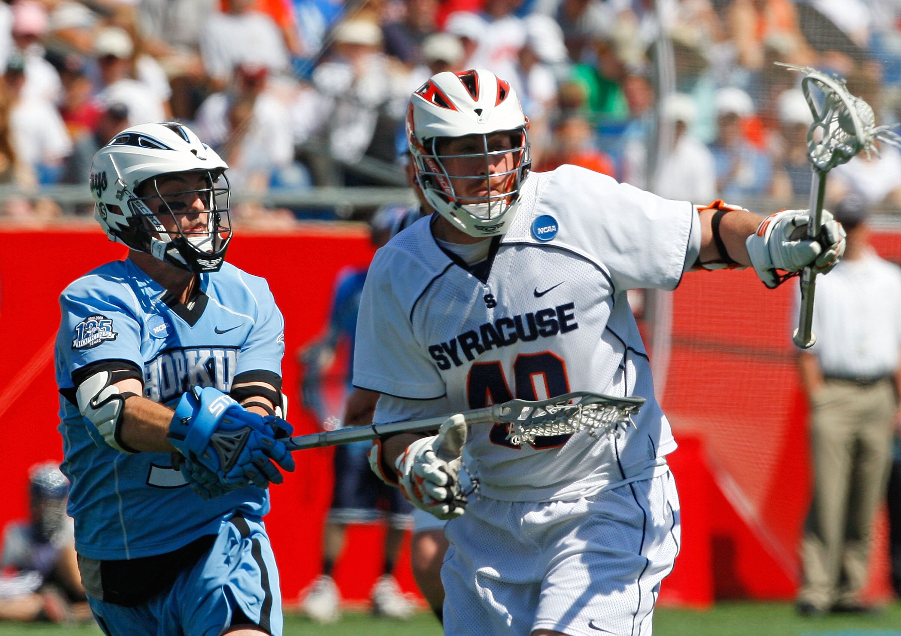 FOXBORO, MA - MAY 26:  Danny Brennan #40 of the Syracuse Orange battles Michael Evan #33 of the Johns Hopkins Blue Jays during the NCAA Lacrosse Championship at Gillette Stadium on May 26, 2008 in Foxboro, Massachusetts. Syracuse captured a 13-10 victory.