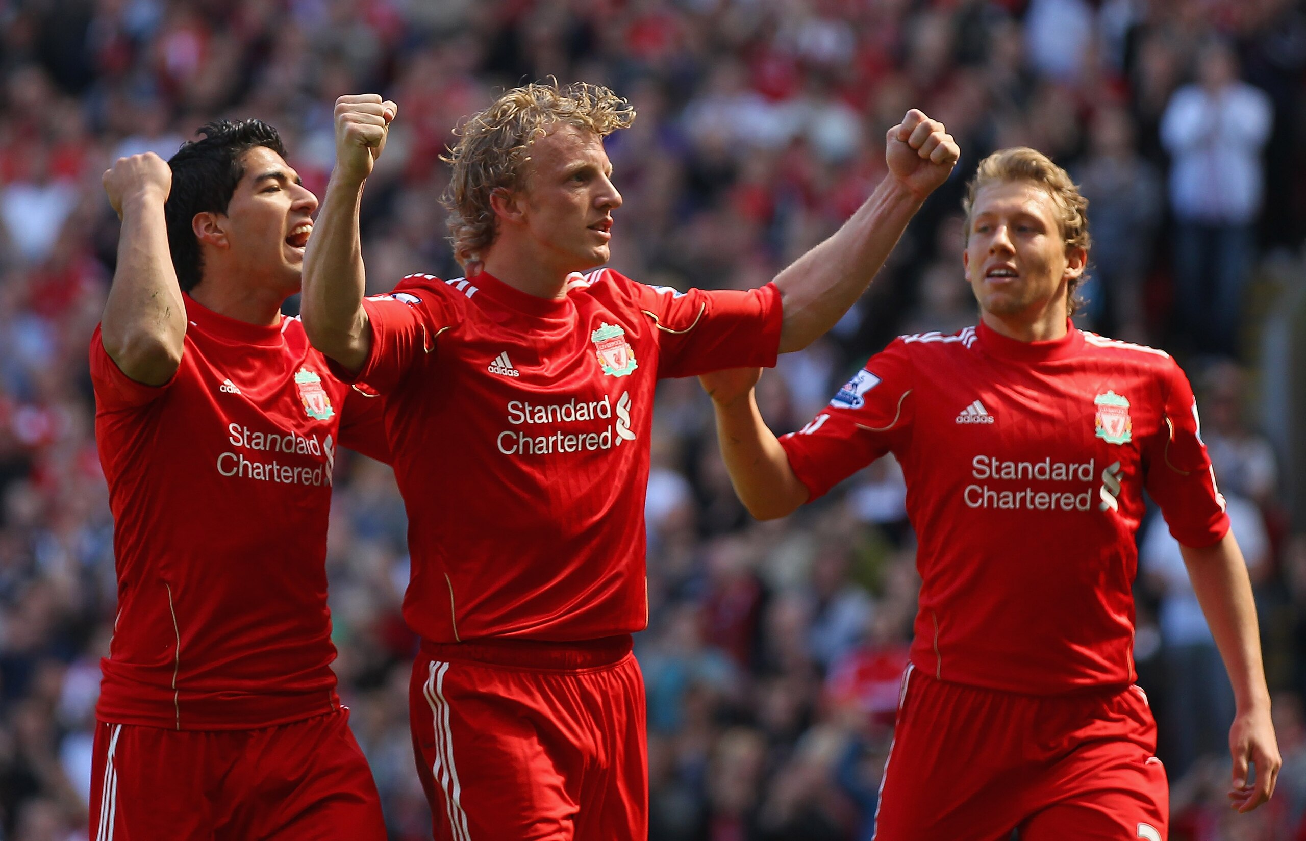 LIVERPOOL, ENGLAND - MAY 01:  Dirk Kuyt of Liverpool celebrates with team mates Luis Suarez and  Lucas after scoring the second goal from the penalty spot during the Barclays Premier League match between Liverpool  and Newcastle United at Anfield on May 1