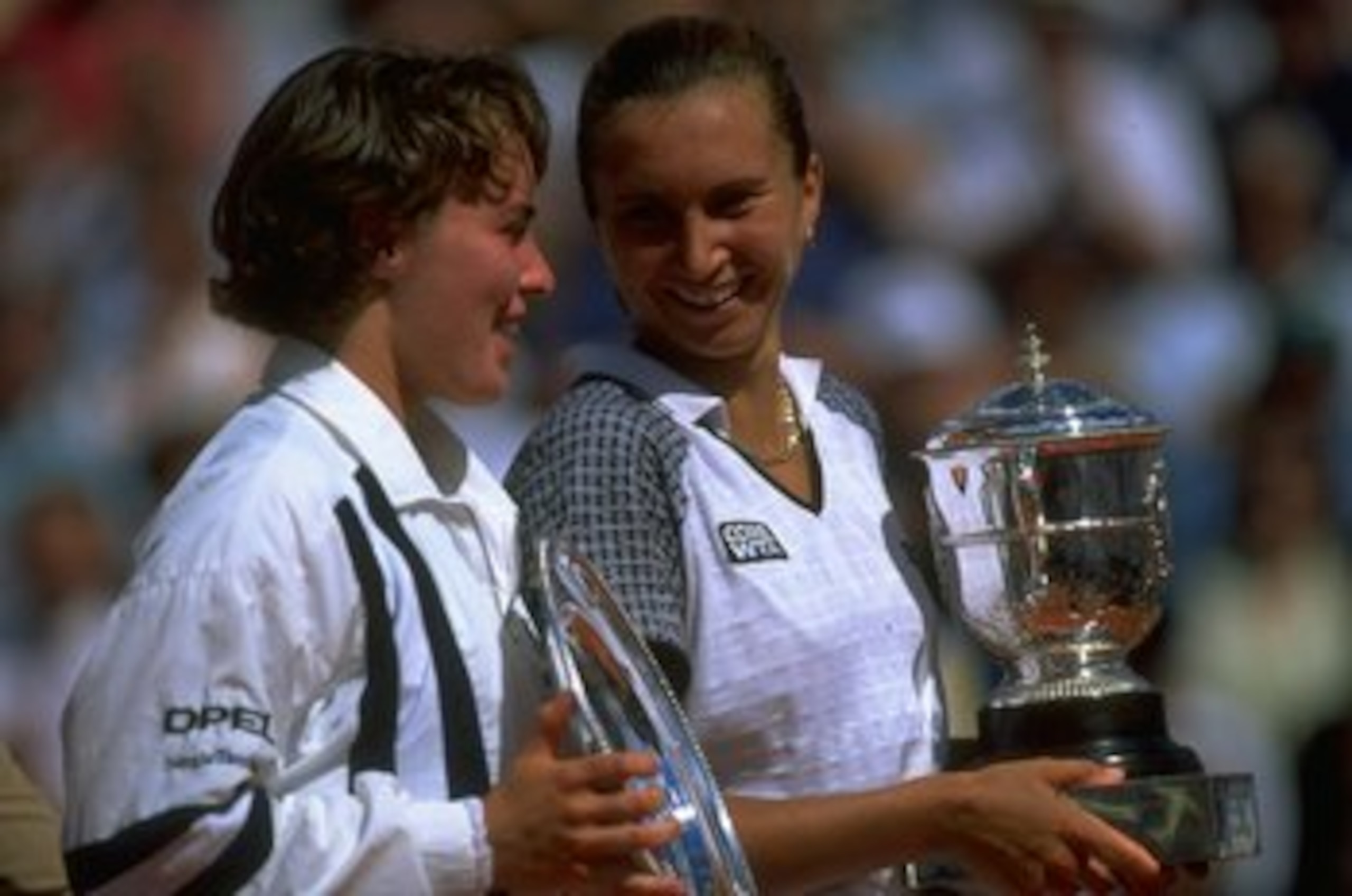 8 Jun 1997: Martina Hingis (left) of Switzerland and Iva Majoli (right) of Croatia hold their respective trophies after the Women's Singles final during the French Open at Roland Garros in Paris. Majoli won the match in straight sets 6-4, 6-2. \ Mandator 8 Jun 1997: Martina Hingis (left) of Switzerland and Iva Majoli (right) of Croatia hold their respective trophies after the Women's Singles final during the French Open at Roland Garros in Paris. Majoli won the match in straight sets 6-4, 6-2. \ Mandator