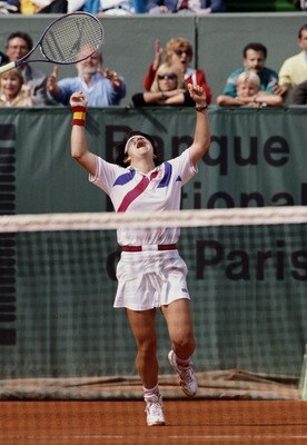 Arantxa Sanchez Vicario of Spain throws her racquet into the air after winning  the Women's Singles final match  against Steffi Graf 7-6, 3-6, 7-5 at the French Open Tennis Championship on 10th June 1989 at the Stade Roland Garros Stadium in Paris, France