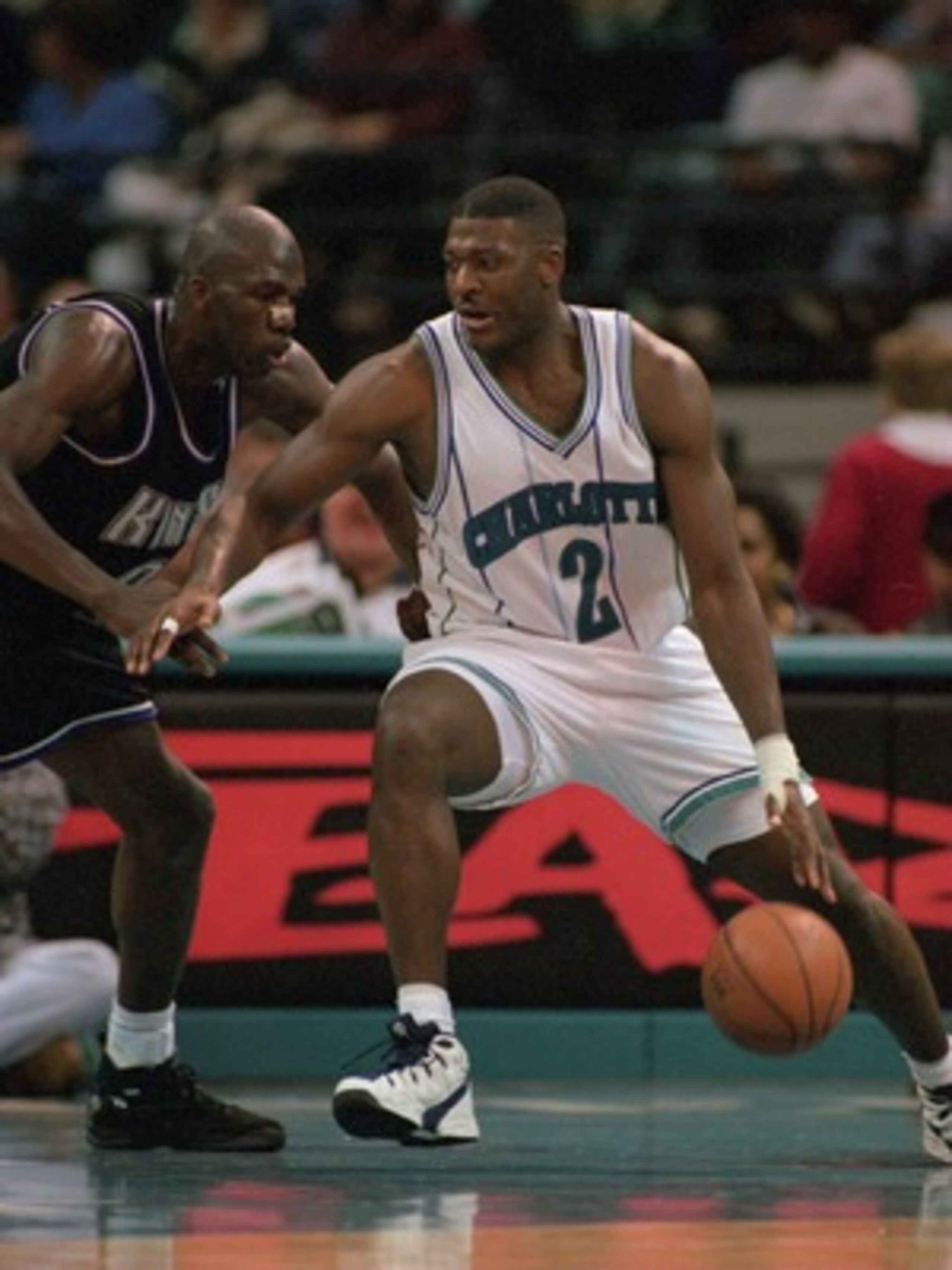 8 Feb 1996: Forward Larry Johnson #2 of the Charlotte Hornets attempts to dribble drive around a defender from the Sacramento Kings during the Hornet''s 115-105 victory over the Kings at the Charlotte Coliseum in Charlotte, North Carolina. Mandatory Cr 8 Feb 1996: Forward Larry Johnson #2 of the Charlotte Hornets attempts to dribble drive around a defender from the Sacramento Kings during the Hornet''s 115-105 victory over the Kings at the Charlotte Coliseum in Charlotte, North Carolina. Mandatory Cr