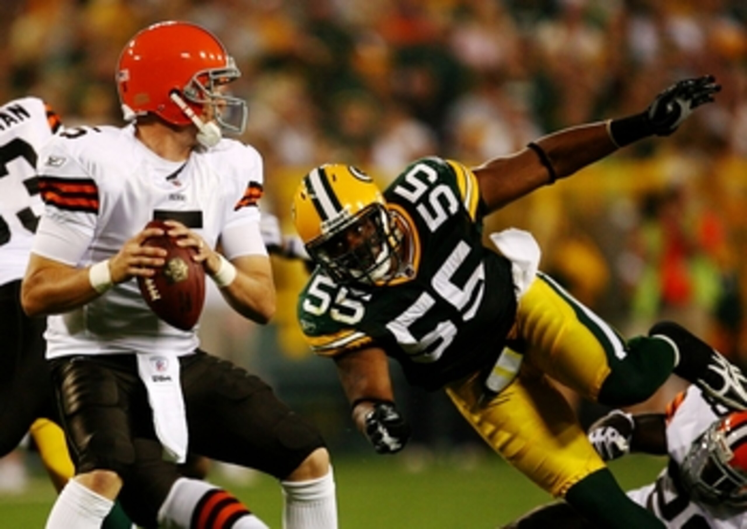 GREEN BAY, WI - AUGUST 15:  Linebacker Desmond Bishop #55 of the Green Bay Packers goes in to sack quarterback Brett Ratliff #5 of the Cleveland Browns in the third quarter during the preseason game at Lambeau Field on August 15, 2009 in Green Bay, Wiscon