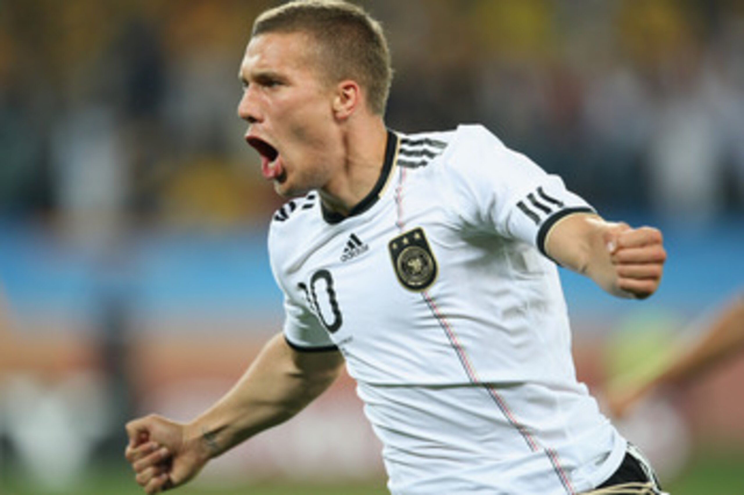 DURBAN, SOUTH AFRICA - JUNE 13:  Lukas Podolski of Germany celebrates scoring the first goal during the 2010 FIFA World Cup South Africa Group D match between Germany and Australia at Durban Stadium on June 13, 2010 in Durban, South Africa.  (Photo by Ste