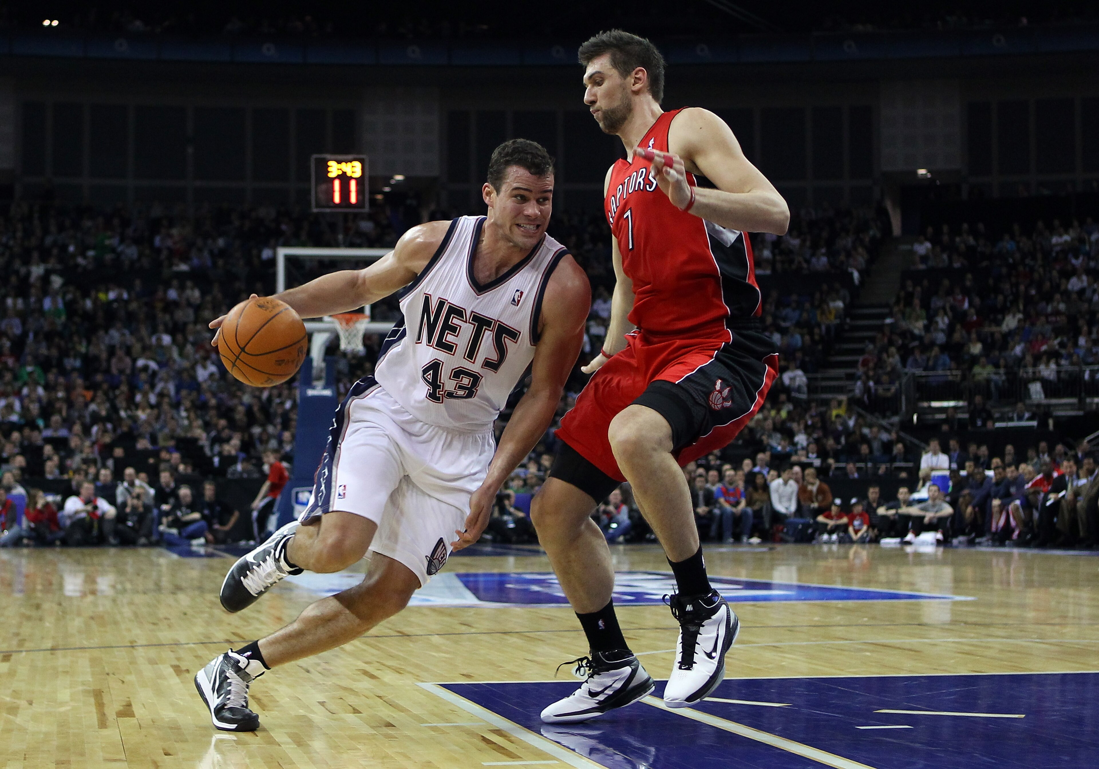 LONDON, ENGLAND - MARCH 04:  Kris Humphries of the Nets goes around Andrea Bargnani of the Raptors during the NBA match between New Jersey Nets and the Toronto Raptors at the O2 Arena on March 4, 2011 in London, England. NOTE TO USER: User expressly ackno