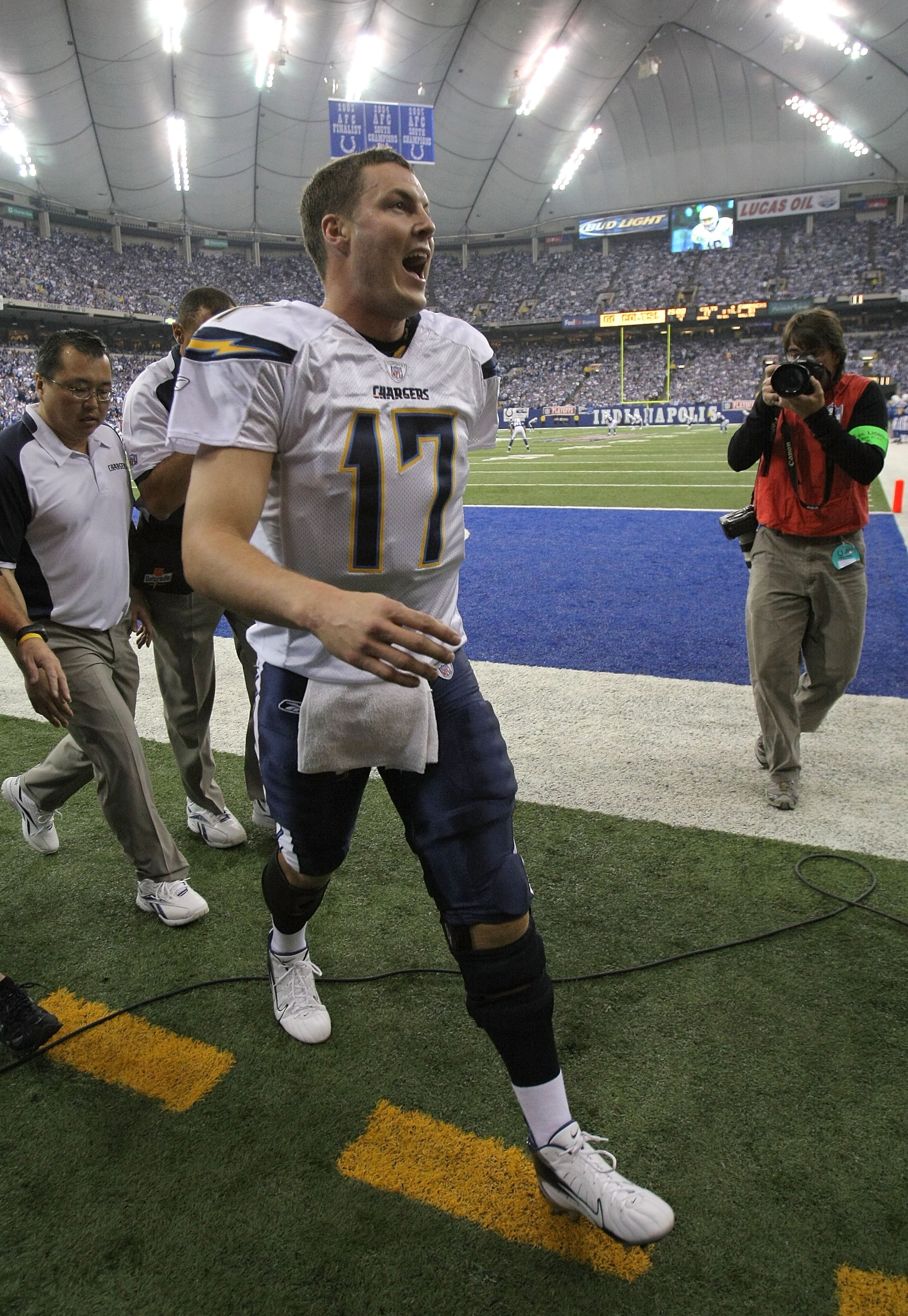 INDIANAPOLIS - JANUARY 13:  Quarterback Philip Rivers #17 of the San Diego Chargers trades verbal barbs with Colts' fans as he walks into the locker room against the Indianapolis Colts during their AFC Divisional Playoff game at the RCA Dome on January 13