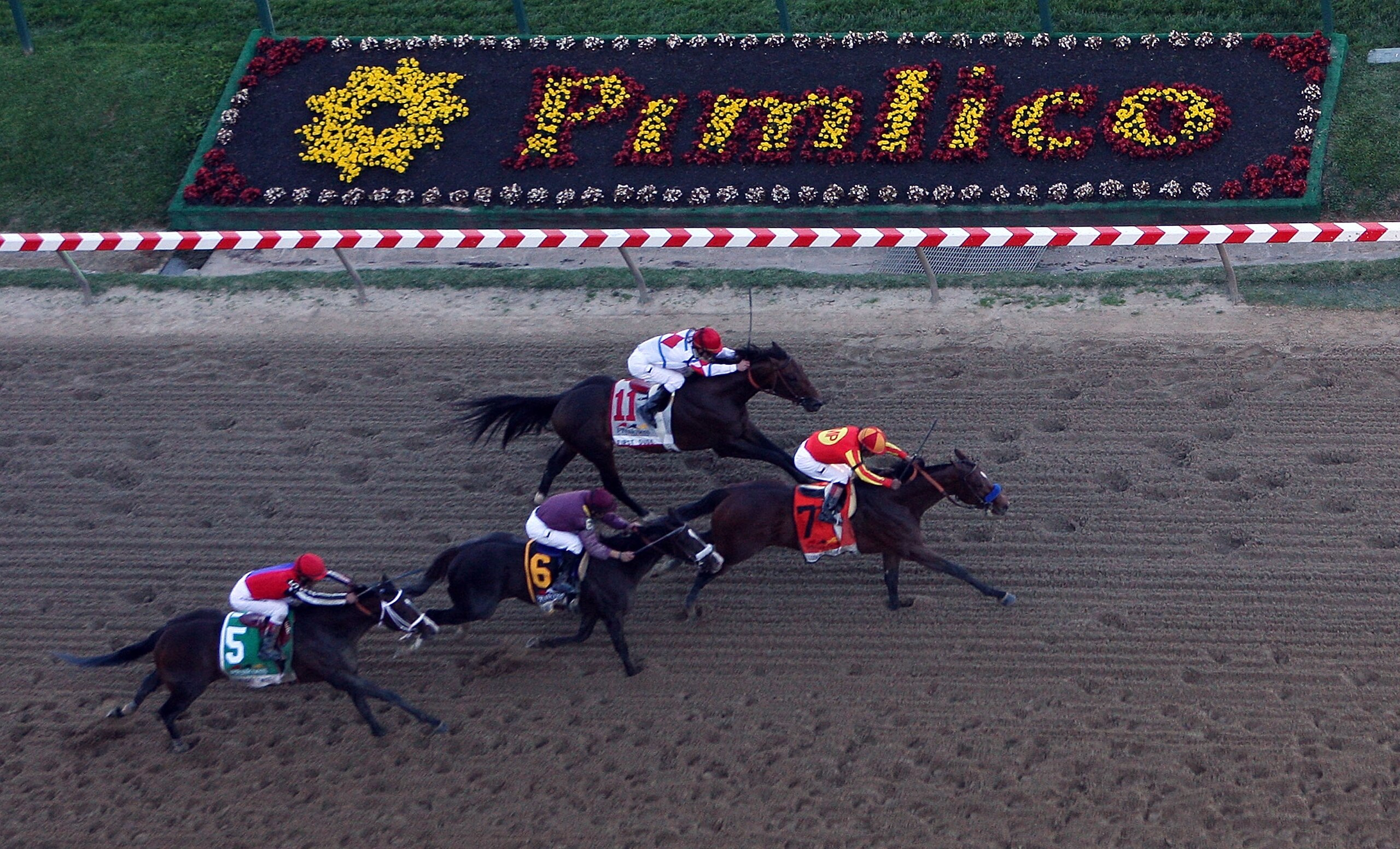 BALTIMORE - MAY 15: Lookin At Lucky (center), ridden by Martin Garcia #7, holds off First Dude, ridden by Ramon Dominguez #11, Jackson Bend , ridden by Mike Smith #6, and Yawanna Twist, ridden by Edgar Prado #5, down the homestrech to win the 135th runni BALTIMORE - MAY 15: Lookin At Lucky (center), ridden by Martin Garcia #7, holds off First Dude, ridden by Ramon Dominguez #11, Jackson Bend , ridden by Mike Smith #6, and Yawanna Twist, ridden by Edgar Prado #5, down the homestrech to win the 135th runni