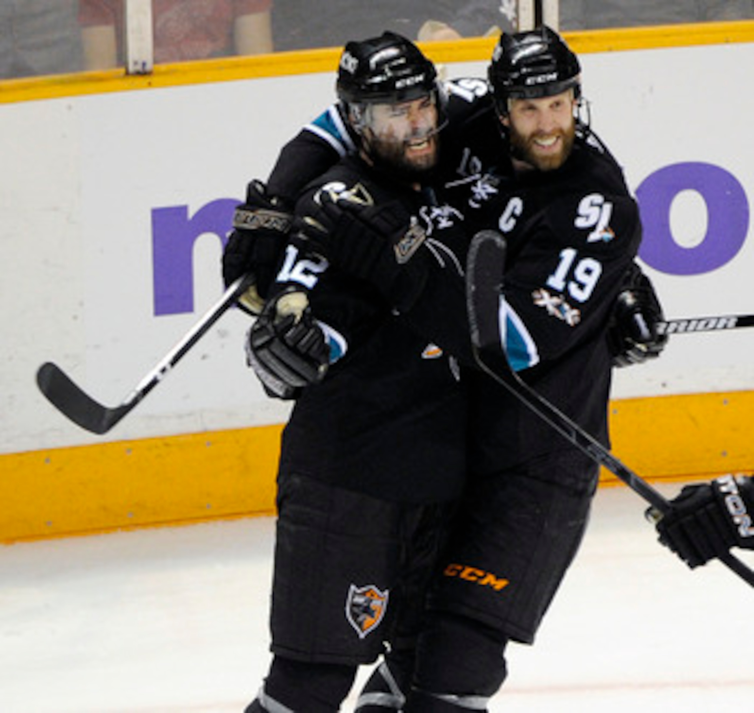 SAN JOSE, CA - MAY 12: Patrick Marleau #12 and Joe Thornton #19 of the San Jose Sharks celebrates after Marleau scored a goal in the third period against the Detroit Red Wings in Game Seven of the Western Conference Semifinals  during the 2011 NHL Stanley