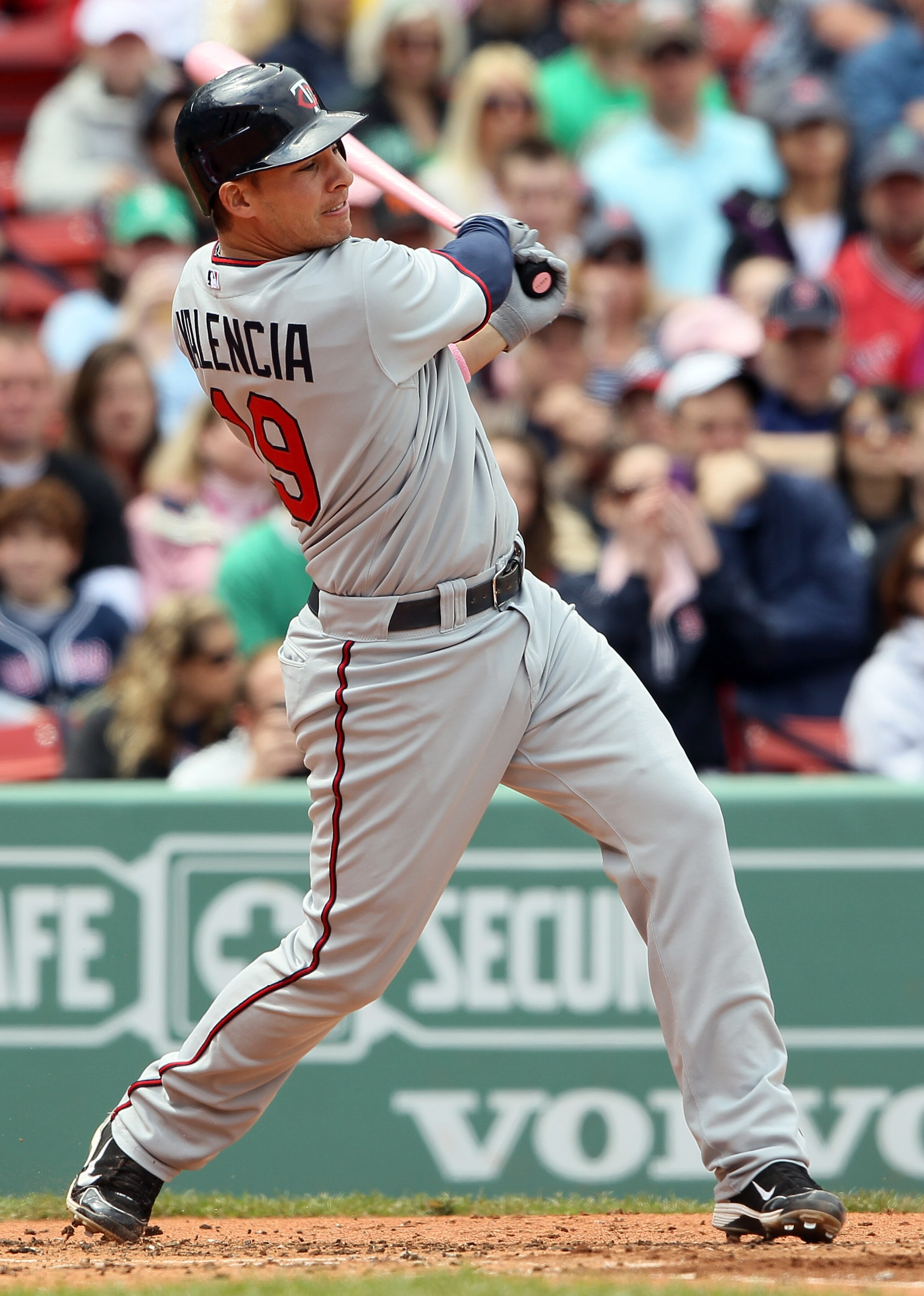 BOSTON, MA - MAY 08: Danny Valencia #19 of the Minnesota Twins hits a 2RBI single in the first inning against the Boston Red Sox on May 8, 2011 at Fenway Park in Boston, Massachusetts.  (Photo by Elsa/Getty Images)