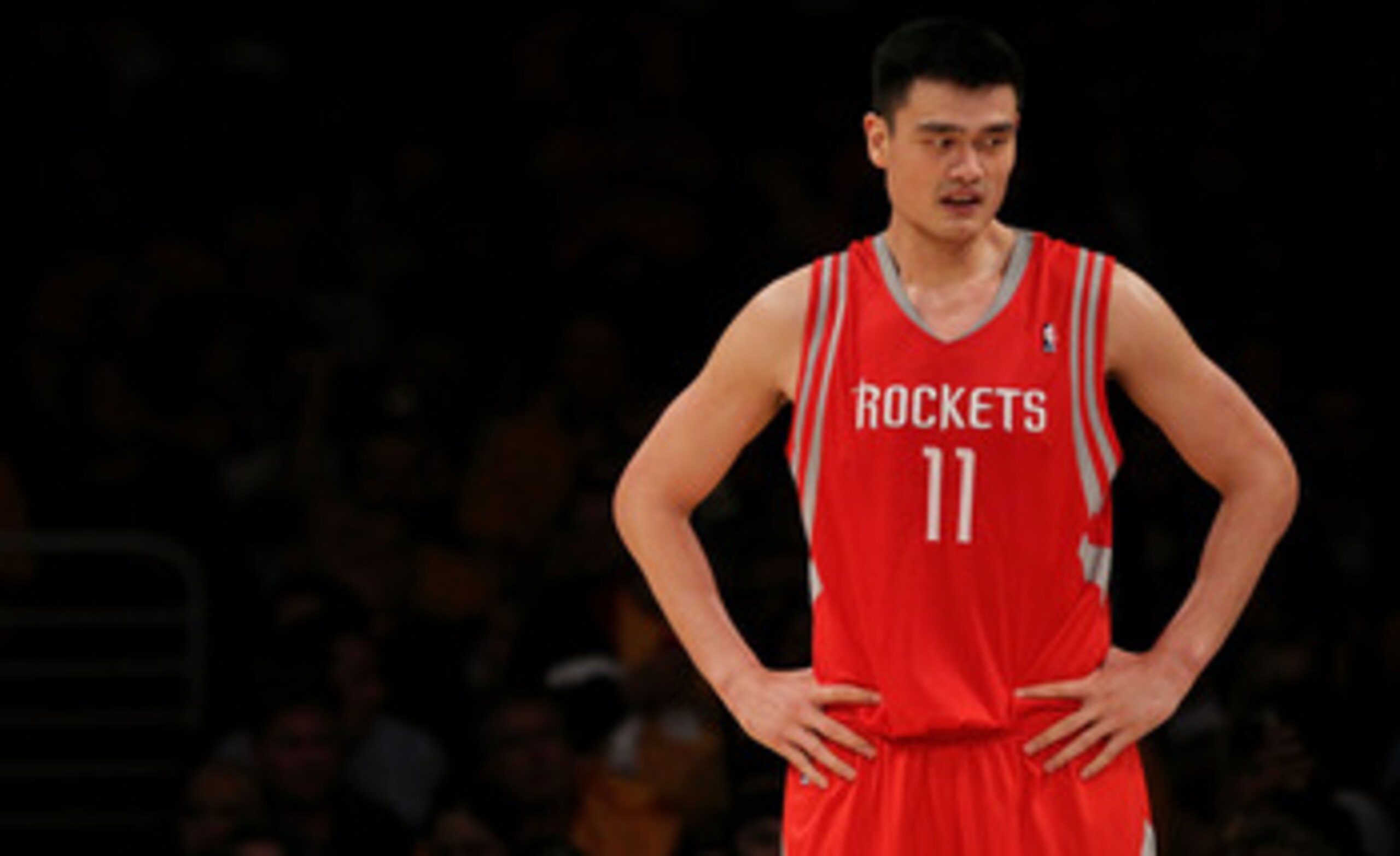LOS ANGELES, CA - OCTOBER 26:  Yao Ming #11 of the Houston Rockets looks on during their opening night game against the Los Angeles Lakers at Staples Center on October 26, 2010 in Los Angeles, California. NOTE TO USER: User expressly acknowledges and agre