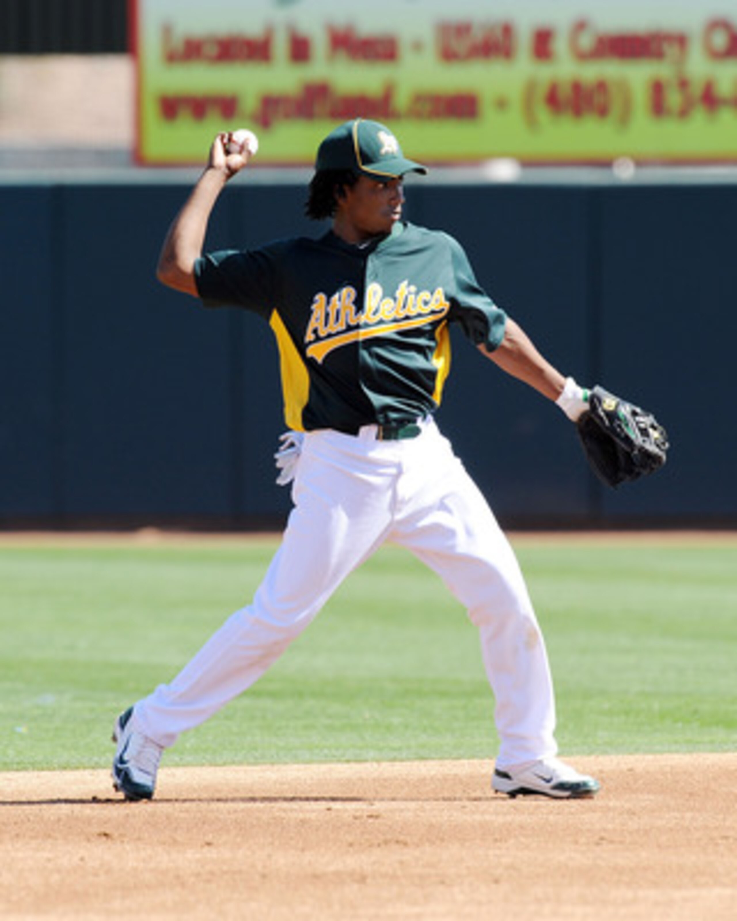 PHOENIX, AZ - MARCH 04: Jemile Weeks #59 of the Oakland Athletics throws the ball to first base against the Texas Rangers at Phoenix Municipal Stadium on March 4, 2011 in Phoenix, Arizona. (Photo by Norm Hall/Getty Images) PHOENIX, AZ - MARCH 04: Jemile Weeks #59 of the Oakland Athletics throws the ball to first base against the Texas Rangers at Phoenix Municipal Stadium on March 4, 2011 in Phoenix, Arizona. (Photo by Norm Hall/Getty Images)