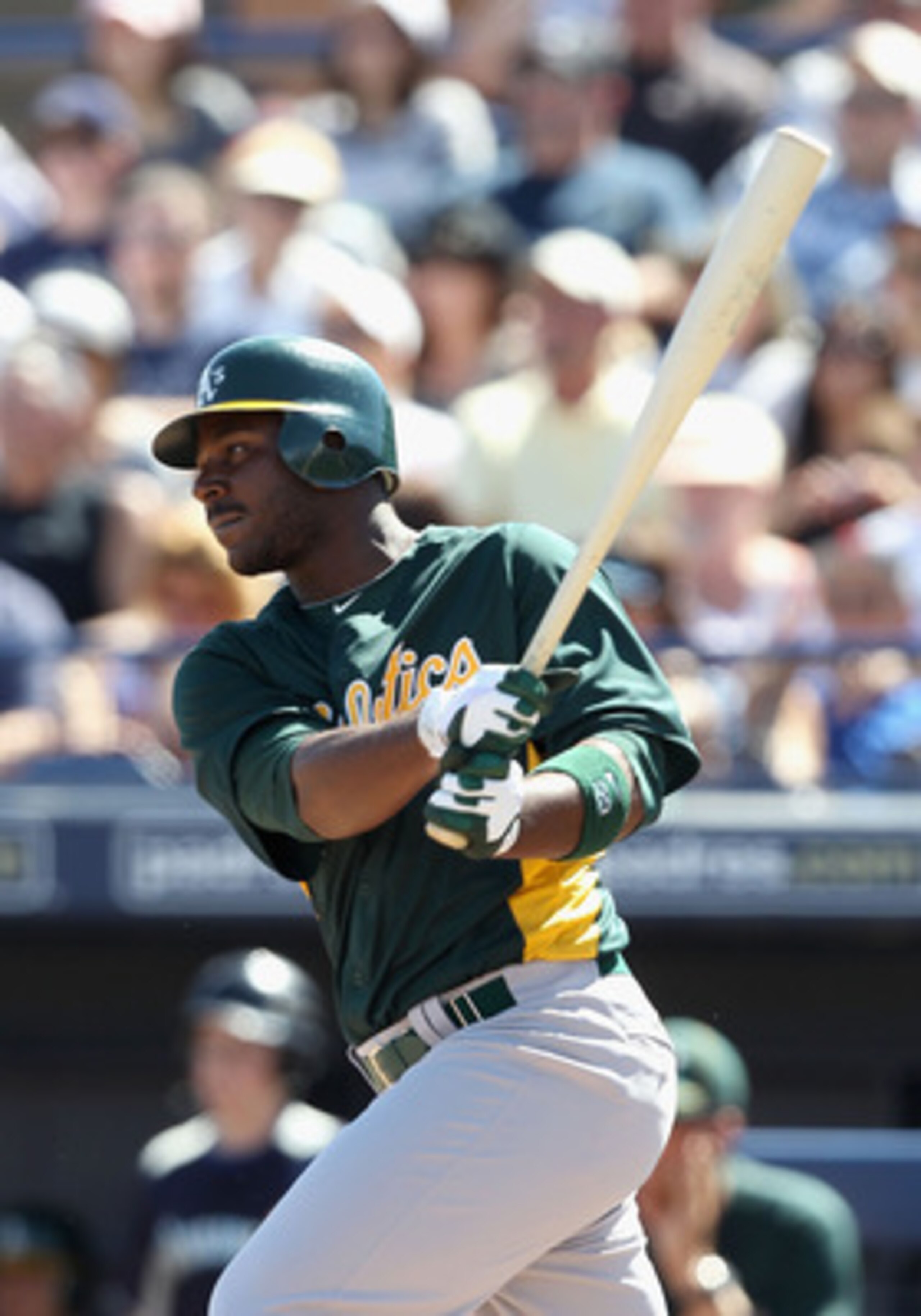 PEORIA, AZ - MARCH 12: Chris Carter #22 of the Oakland Athletics bats against the Seattle Mariners during the spring training game at Peoria Stadium on March 12, 2011 in Peoria, Arizona. (Photo by Christian Petersen/Getty Images) PEORIA, AZ - MARCH 12: Chris Carter #22 of the Oakland Athletics bats against the Seattle Mariners during the spring training game at Peoria Stadium on March 12, 2011 in Peoria, Arizona. (Photo by Christian Petersen/Getty Images)