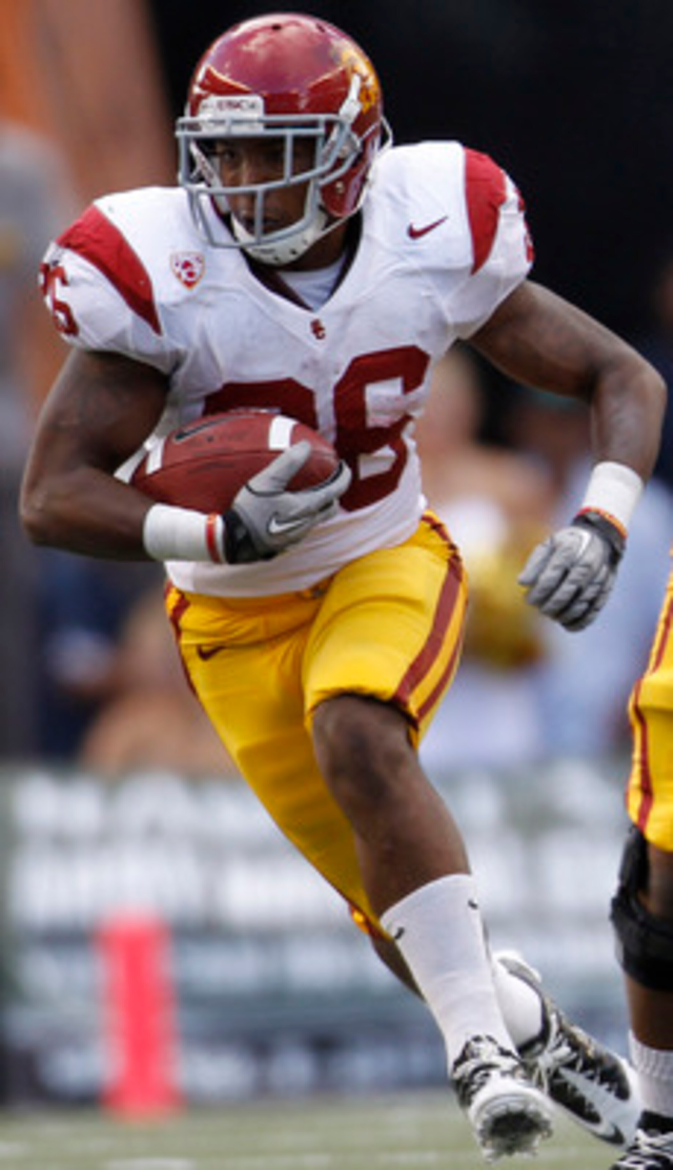 HONOLULU - SEPTEMBER 02: Marc Tyler #26 of the University of Southern California Trojans carries the ball during first half action against the University of Hawaii Warriors at Aloha Stadium September 2, 2010 in Honolulu, Hawaii. (Photo by Kent Nishimura/G