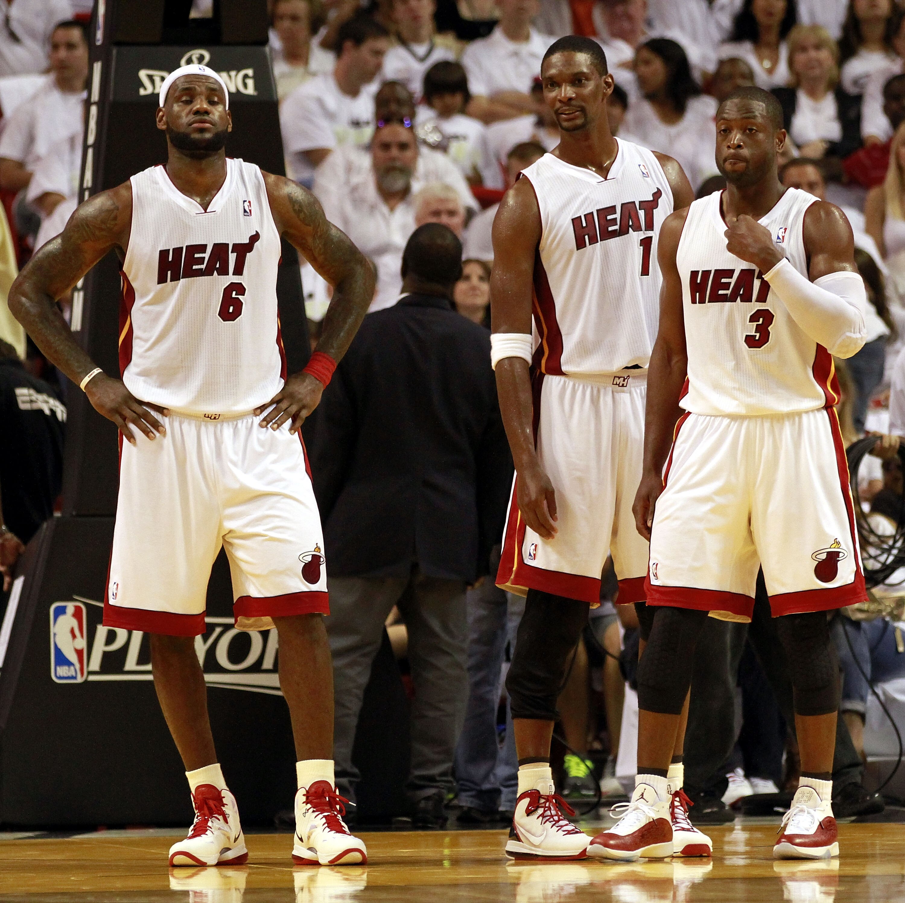 MIAMI, FL - APRIL 16:  Forward Chris Bosh #1 of the  Miami Heat with teammates Dwyane Wade #3 and LeBron James #6 against the Philadelphia 76ers at the American Airlines Arena in Game One of the Eastern Conference Quarterfinals in the 2011 NBA Playoffs on