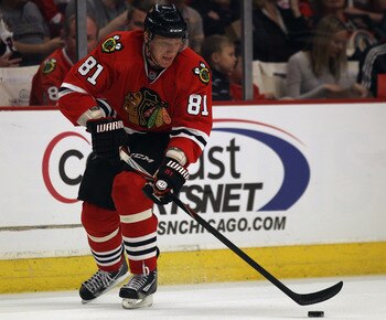 CHICAGO, IL - APRIL 10: Marian Hossa #81 of the Chicago Blackhawks controls the puck against the Detroit Red Wings at the United Center on April 10, 2011 in Chicago, Illinois. The Red Wings defeated the Blackhawks 4-3. (Photo by Jonathan Daniel/Getty Imag