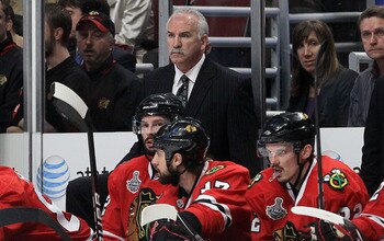 CHICAGO - MAY 31:  Head coach Joel Quenneville of the Chicago Blackhawks looks on from the bench in the second period while taking on the Philadelphia Flyers in Game Two of the 2010 NHL Stanley Cup Final at the United Center on May 31, 2010 in Chicago, Il