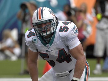 MIAMI, FL - OCTOBER 21: Linebacker Zach Thomas #54 of the  Miami Dolphins lines up against the New England Patriots at Dolphin Stadium on October 21, 2007 in Miami, Florida.  The Pats won 49 - 28. (Photo by Al Messerschmidt/Getty Images)
