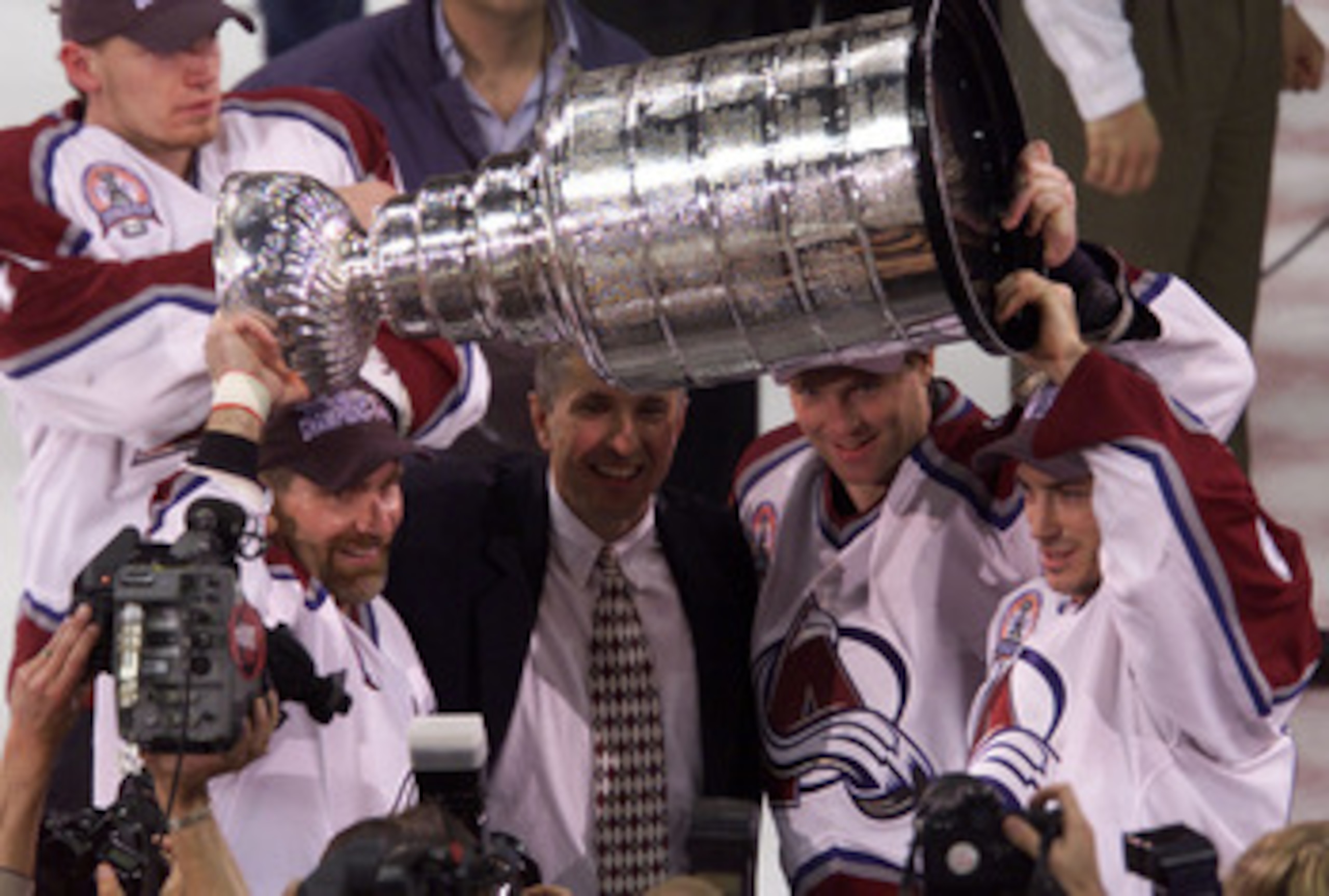 9 Jun 2001: Ray Bourque, coach Bob Hartley, Patrick Roy and Joe Sakic of the Colorado Avalanche celebrate defeating the New Jersey Devils to win the Stanley Cup finals at the Pepsi Center in Denver, Colorado. The Avalanche defeated the Devils 3-1 to win t