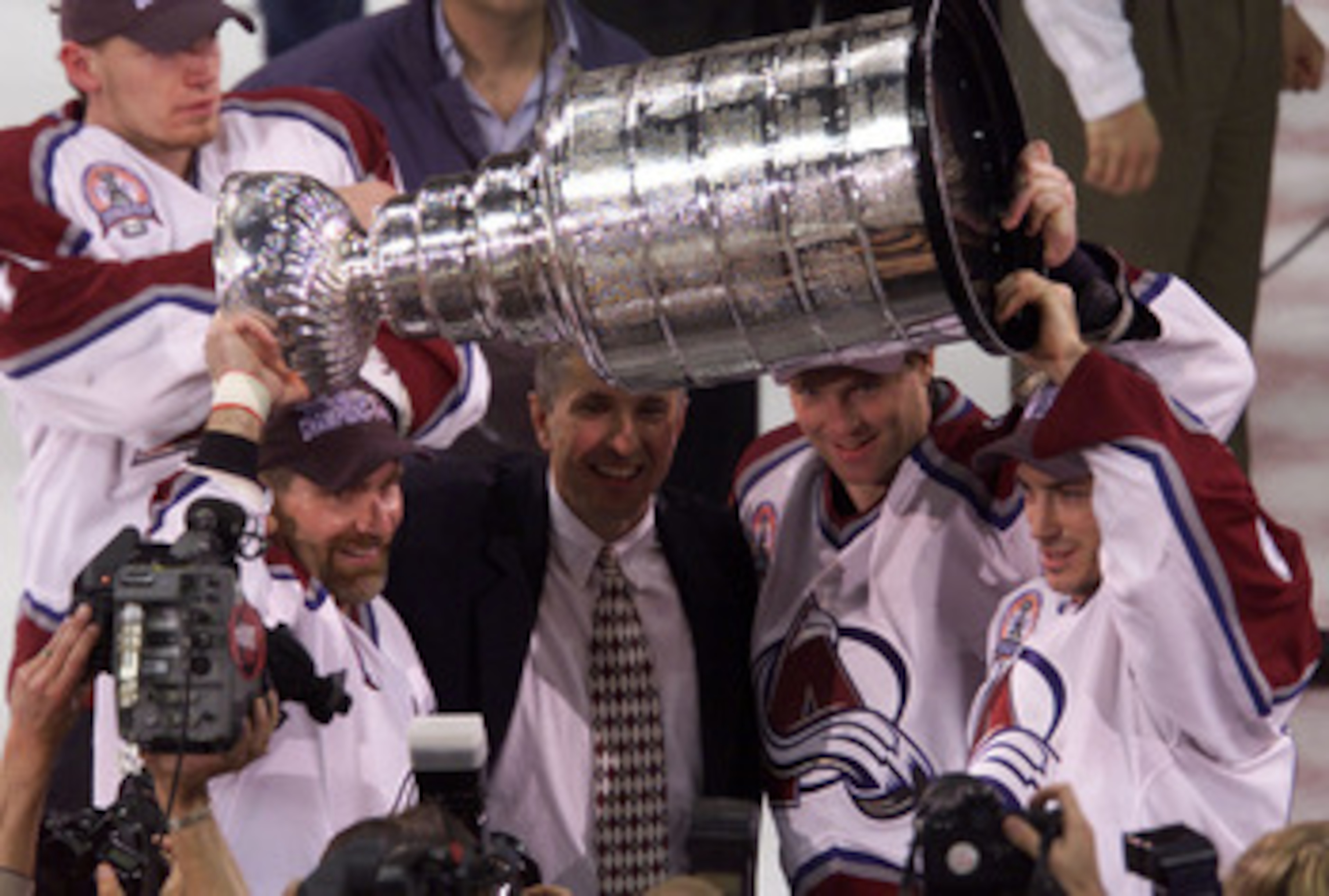 9 Jun 2001: Ray Bourque, coach Bob Hartley, Patrick Roy and Joe Sakic of the Colorado Avalanche celebrate defeating the New Jersey Devils to win the Stanley Cup finals at the Pepsi Center in Denver, Colorado. The Avalanche defeated the Devils 3-1 to win t