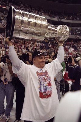 16 Jun 1998:  Scotty Bowman of the Detroit Red Wings holds up the Stanley Cup during the Stanley Cup Finals game against the Washington Capitals at the MCI Center in Washington, D. C.. The Red Wings defeated the Capitals 4-1. Mandatory Credit: Rick Stewar