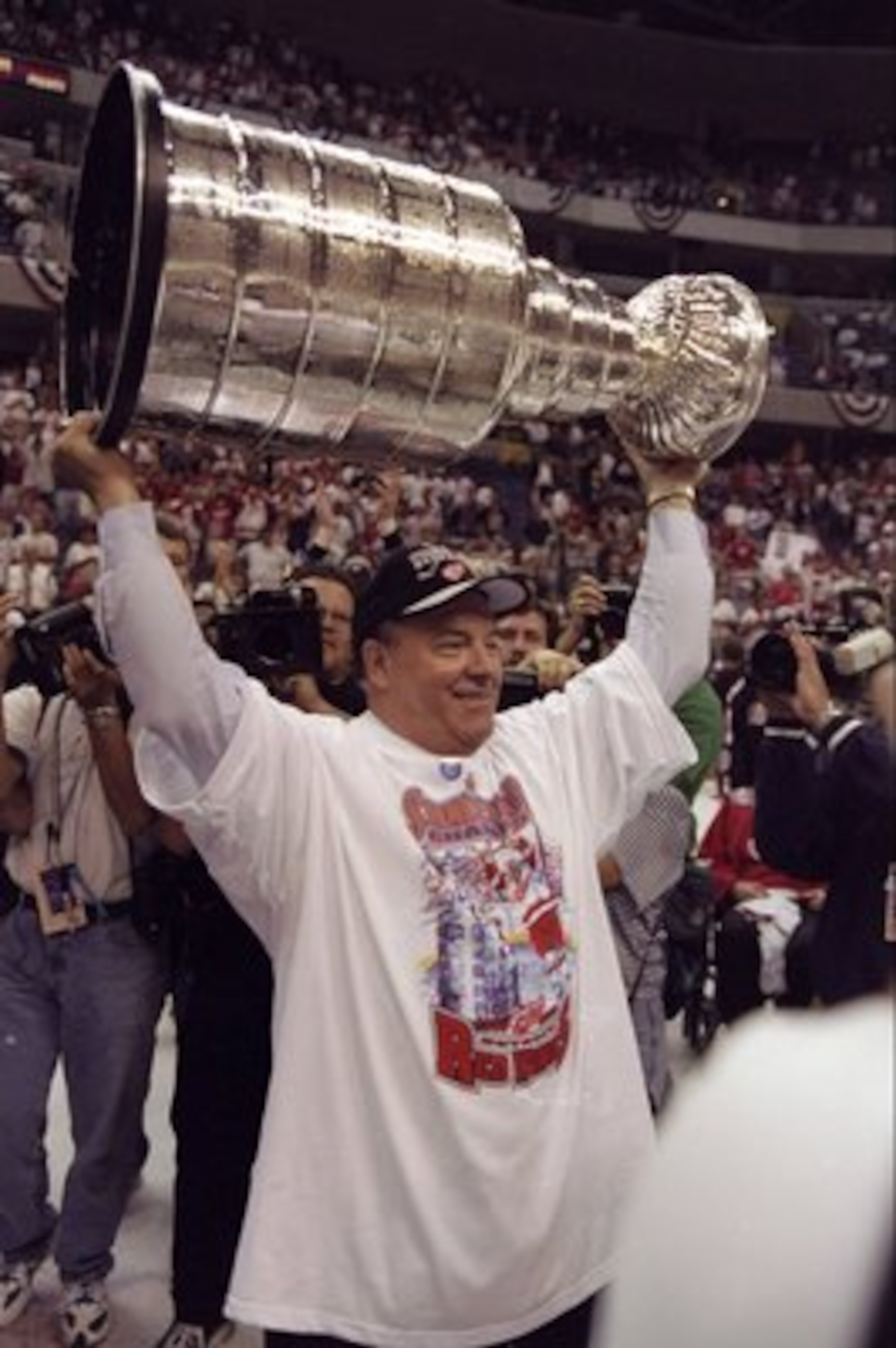 16 Jun 1998:  Scotty Bowman of the Detroit Red Wings holds up the Stanley Cup during the Stanley Cup Finals game against the Washington Capitals at the MCI Center in Washington, D. C.. The Red Wings defeated the Capitals 4-1. Mandatory Credit: Rick Stewar