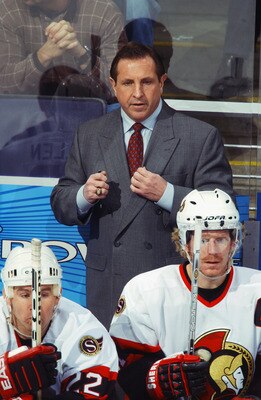 WASHINGTON D.C. - NOVEMBER 29:   Head coach Jacques Martin of the Ottawa Senators watches the game against the Washington Capitals at the MCI Center on November 29, 2002 in Washington D.C. The Senators won 6-2.  (Photo by Mitchell Layton/Getty Images/NHLI