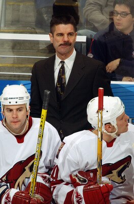WASHINGTON - JANUARY 7:  Head coach Bob Francis of the Phoenix Coyotes looks on from behind the bench against the Washington Capitals during the game at MCI Center on January 7, 2004 in Washington D.C.  The Coyotes defeated the Capitals 3-0.  (Photo by Mi