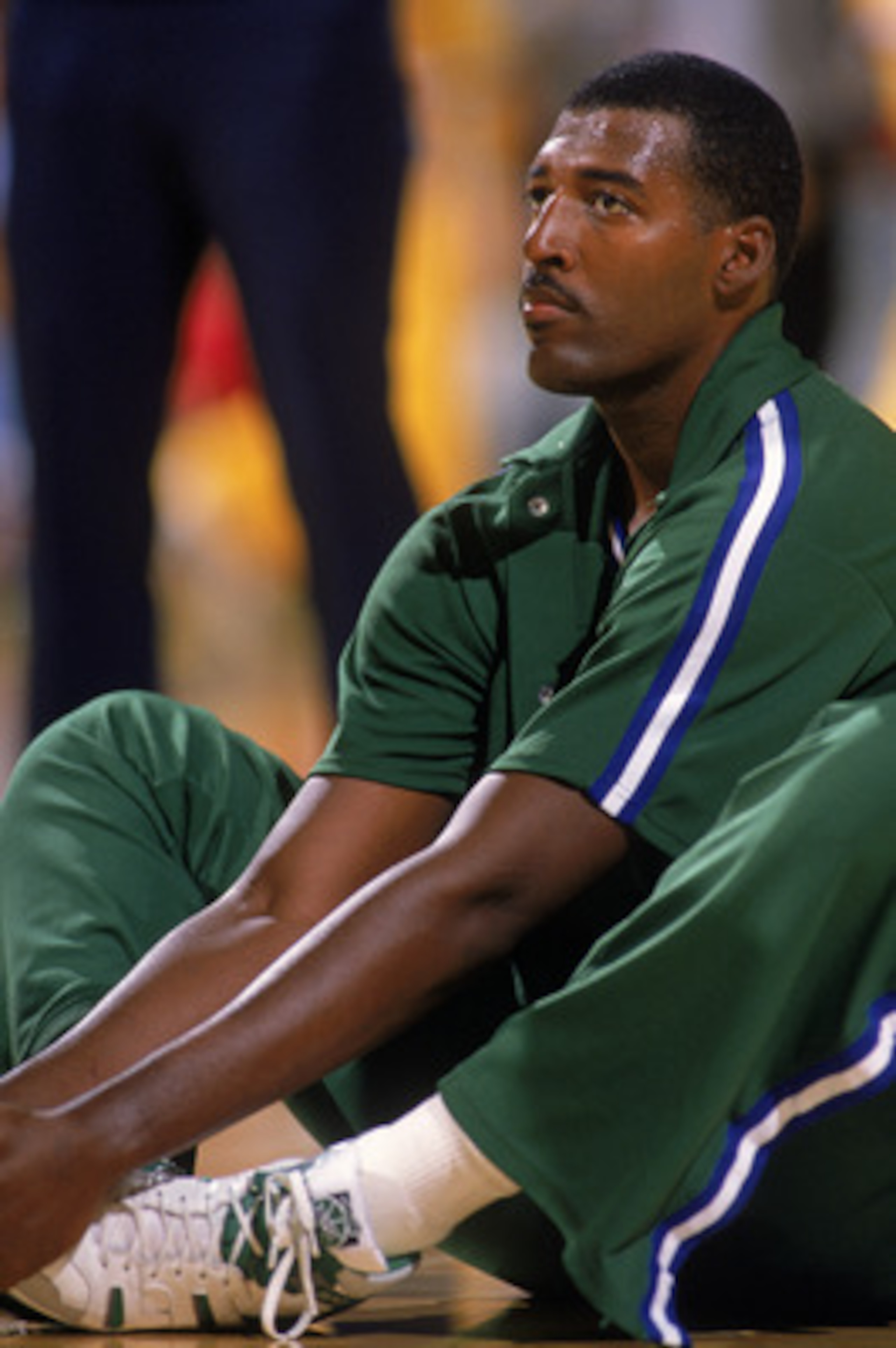 LOS ANGELES - 1989:  Roy Tarpley #42 of the Dallas Mavericks stretches during warm-ups prior to the NBA game against the Los Angeles Lakers at the Great Western Forum in Los Angeles, California in 1989.  (Photo by Mike Powell/Getty Images)