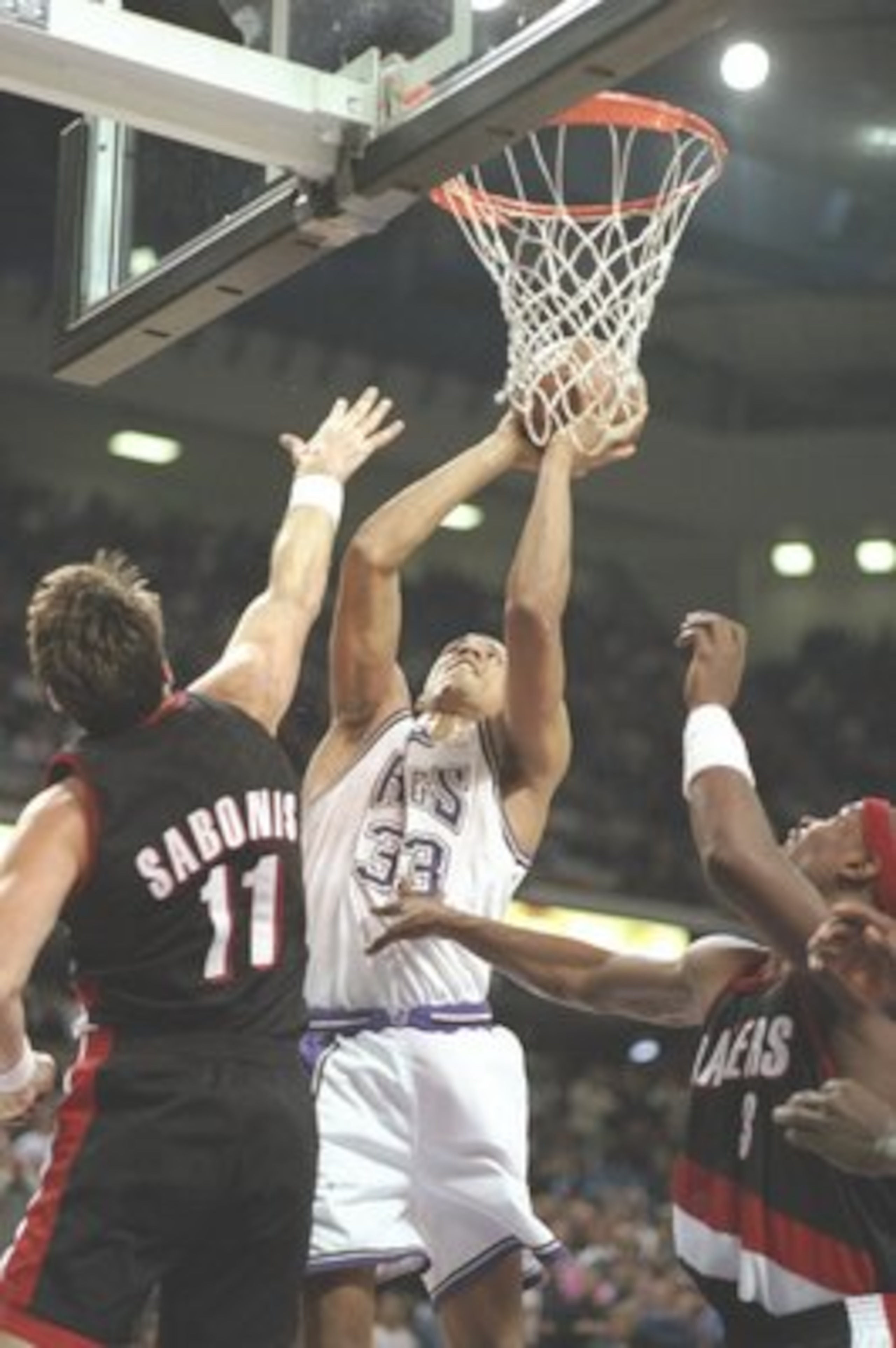 9 Nov 1996:  Forward Brian Grant of the Sacramento Kings and center Arvydas Sabonis of the Portland Trailblazers jump for the ball during a game at the Arco Arena in Sacramento, California.  The Kings won the game 103-102. Mandatory Credit: Otto Greule  /