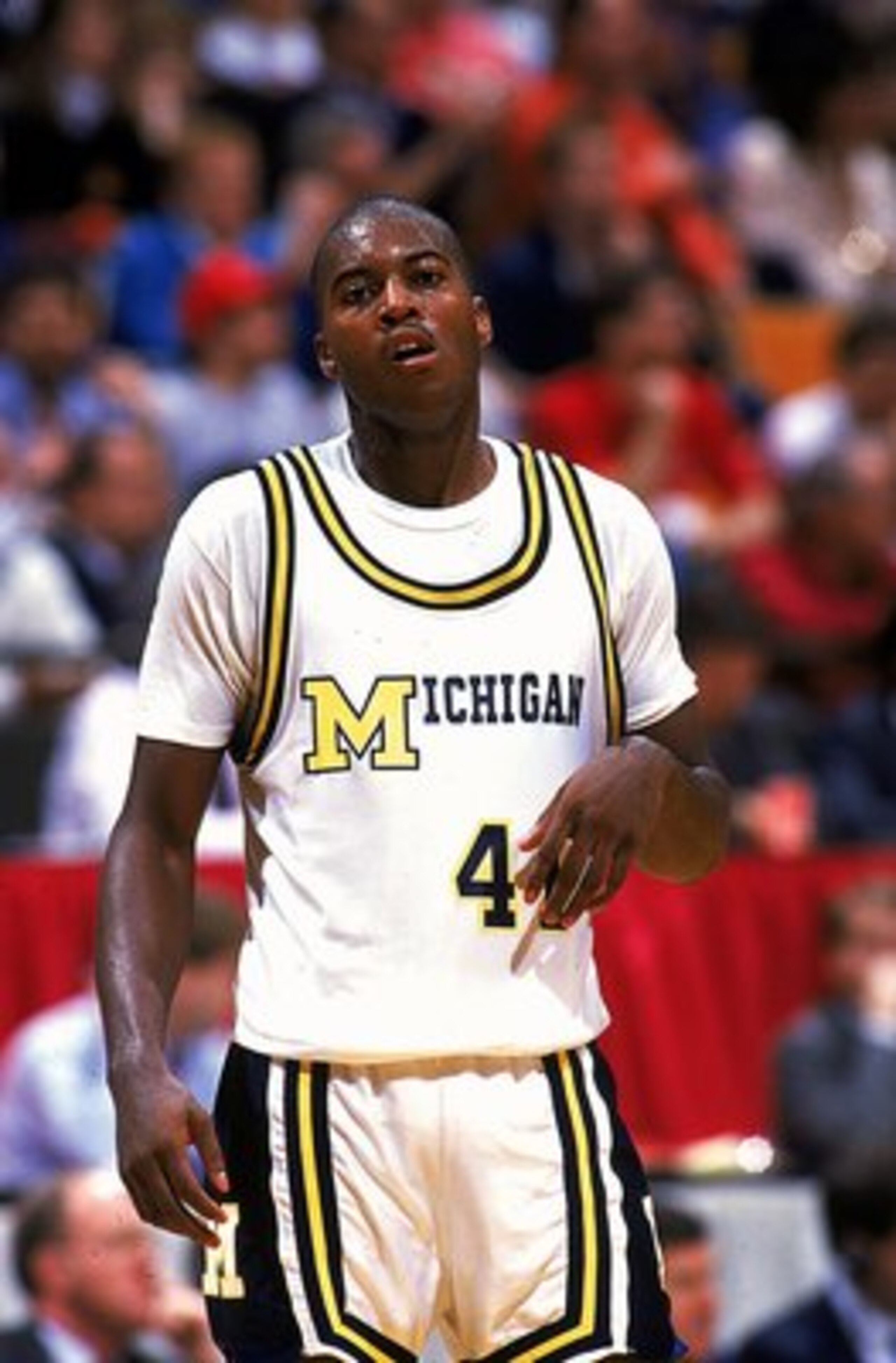 Glen Rice #4 of the University of Michigan Wolverines walks on the court.