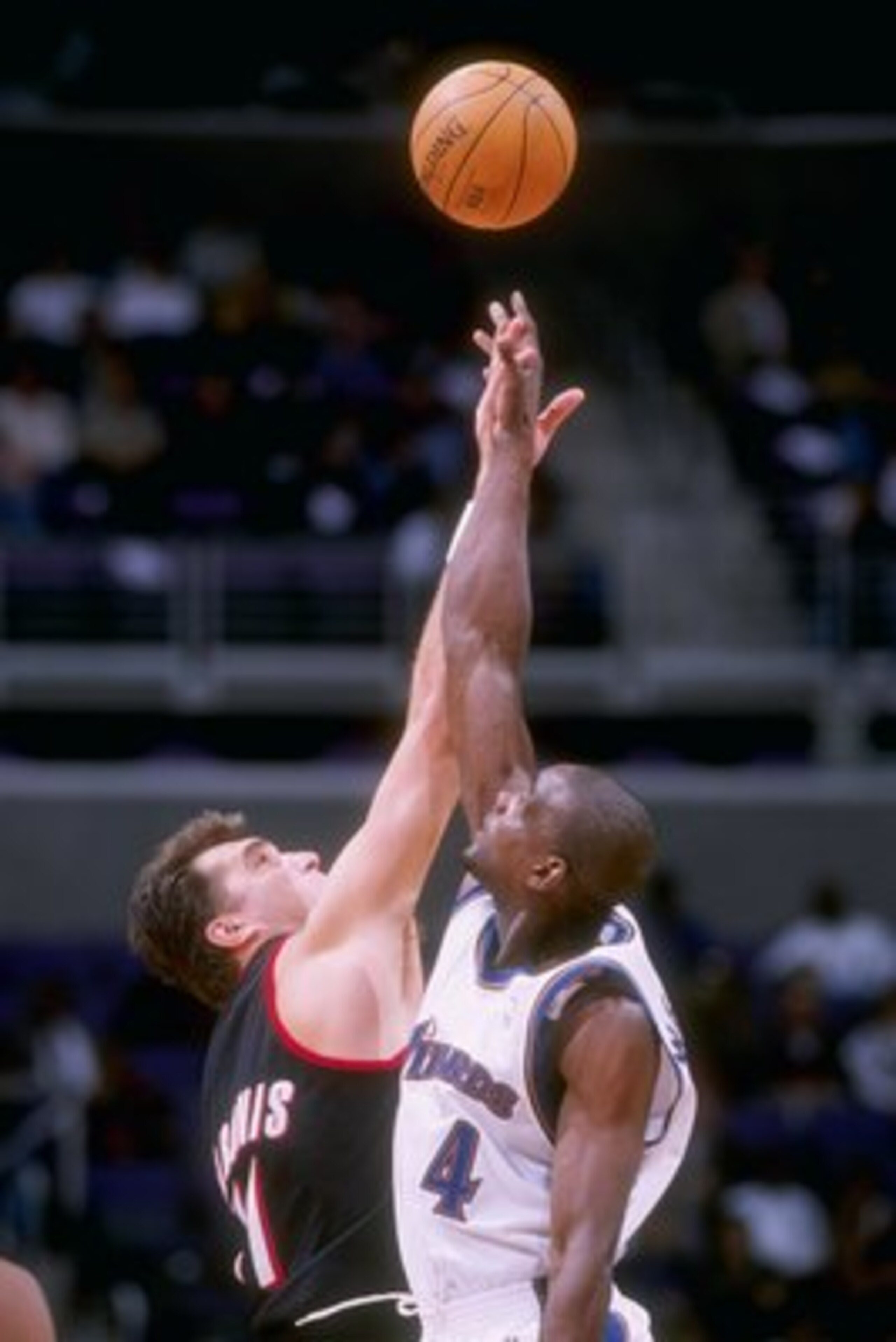 21 Jan 1998: Chris Webber #4 of the Washington Wizards and Arvydas Sabonis #11 of the Portland Trailblazers do a jumpball during the Wizards 100-87 loss at the MCI Center in Washington, D.C.