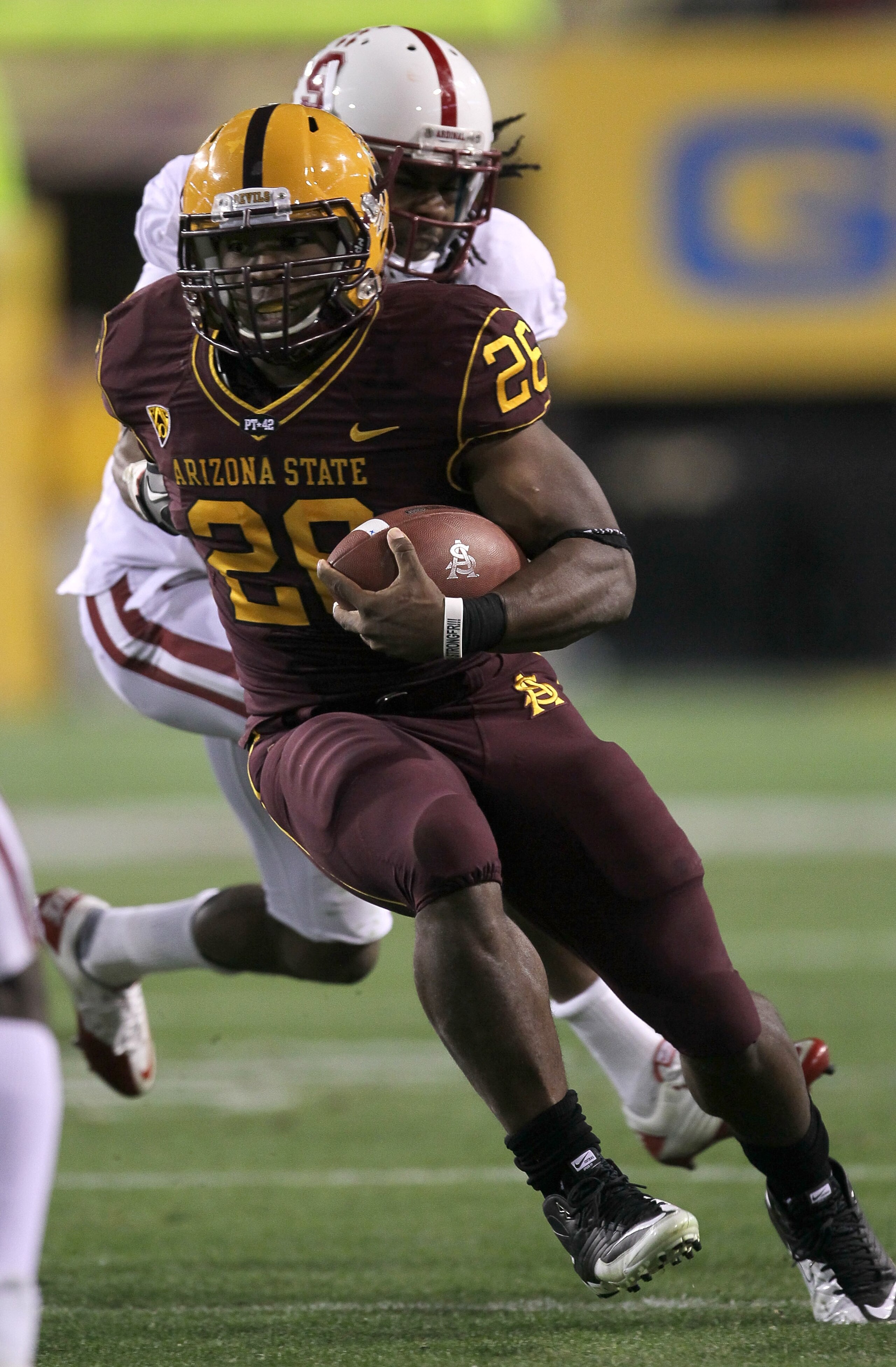 TEMPE, AZ - NOVEMBER 13:  Running back Cameron Marshall #26 of the Arizona State Sun Devils carries the ball against cornerback Richard Sherman #9 of the Stanford Cardinal at Sun Devil Stadium on November 13, 2010 in Tempe, Arizona.  (Photo by Stephen Dun