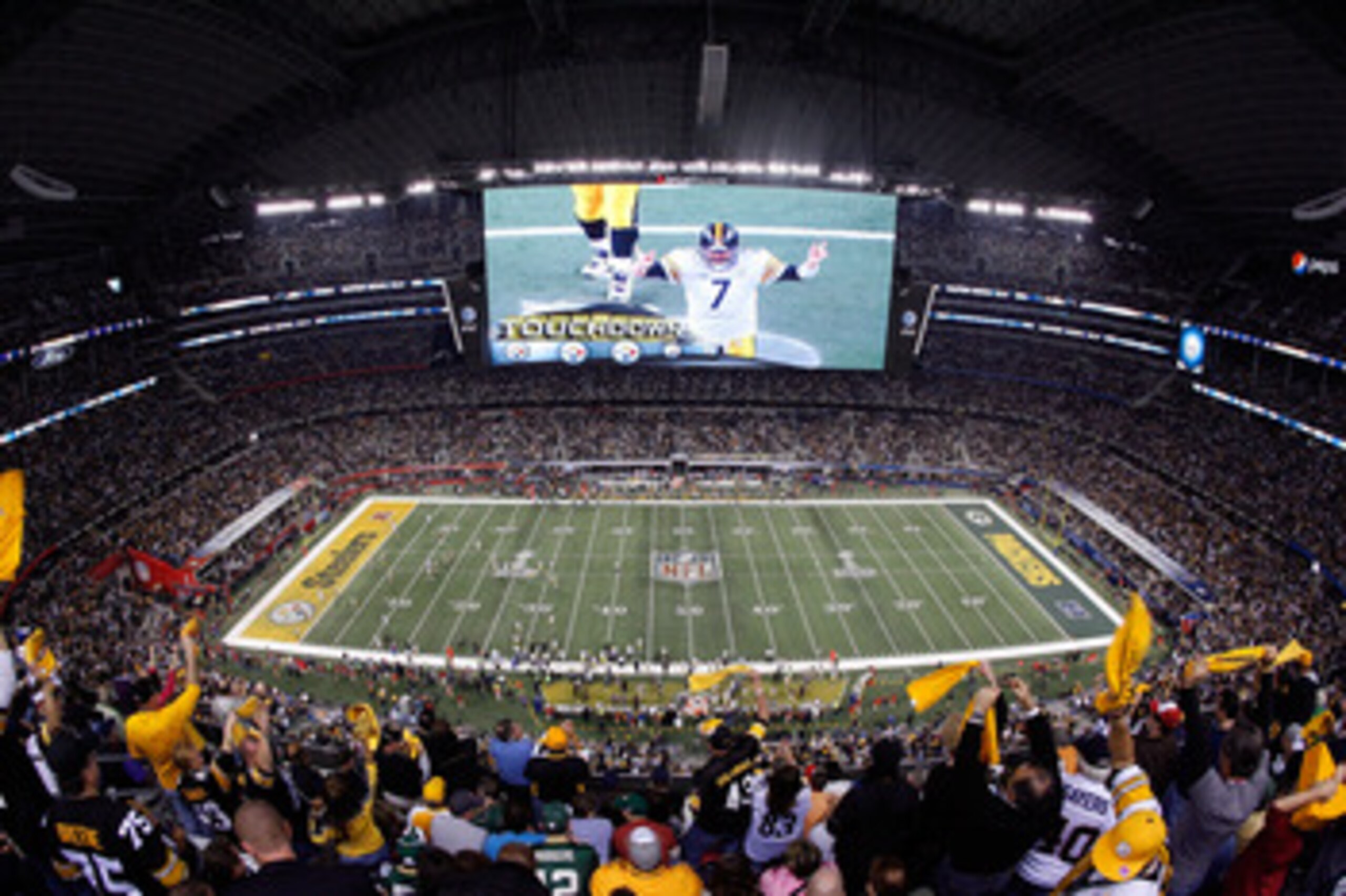 ARLINGTON, TX - FEBRUARY 06:  Quarterback Ben Roethlisberger #7 of the Pittsburgh Steelers is seen on the screen after the Steelers score a touchdown in the second half while taking on the Green Bay Packers during Super Bowl XLV at Cowboys Stadium on Febr